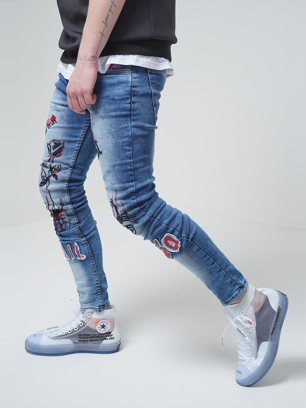 Lower body shot of a man wearing ROSE TATTOO skinny jeans