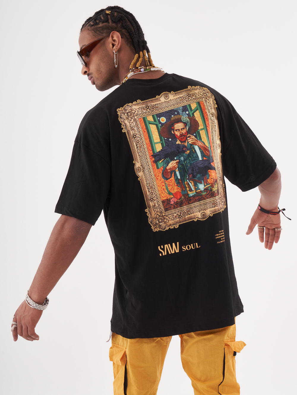 The back of a man wearing a Vincent t-shirt with a picture on it.
