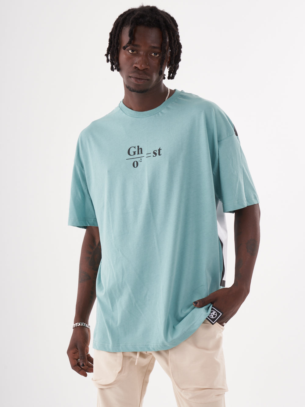 A man wearing a blue GHOST T-SHIRT with the word ghost on it.