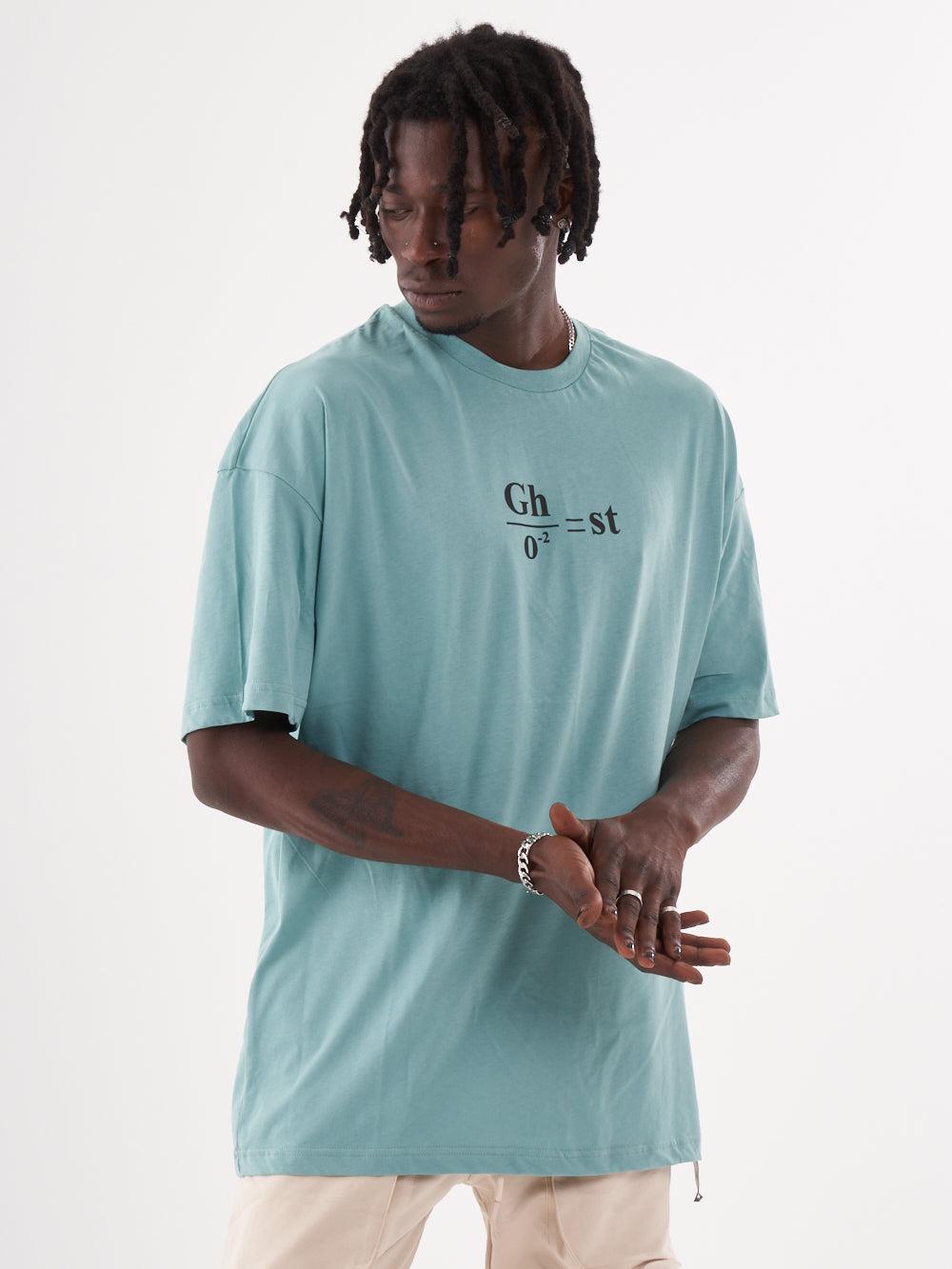 A man wearing a blue GHOST T-SHIRT with the word ghetto on it.