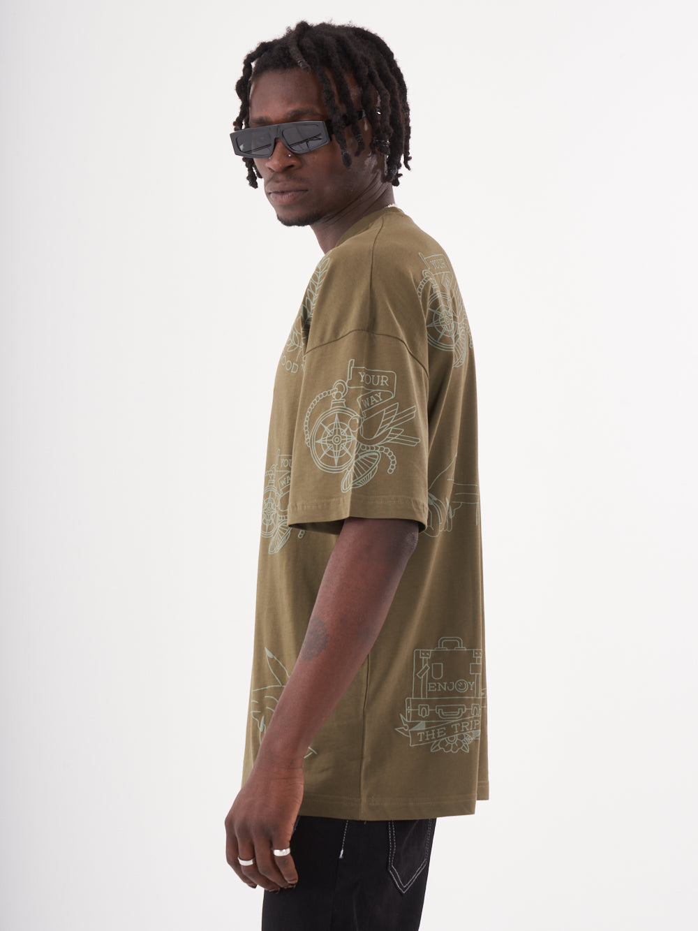 A man wearing a VICTORY T-SHIRT and sunglasses.