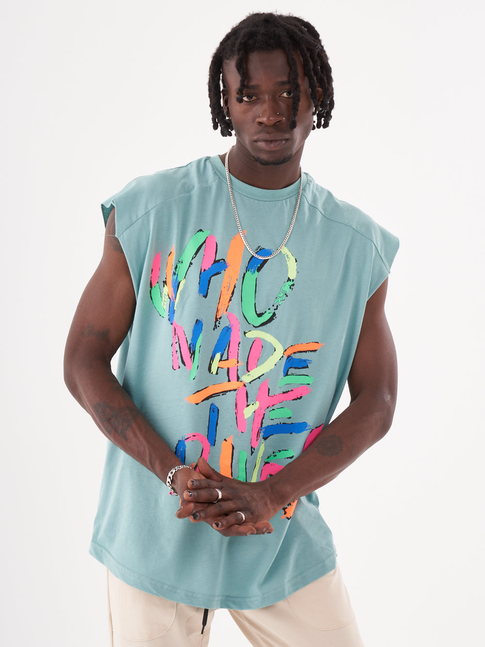 A man wearing a REBELLION T-SHIRT that says who made the river.