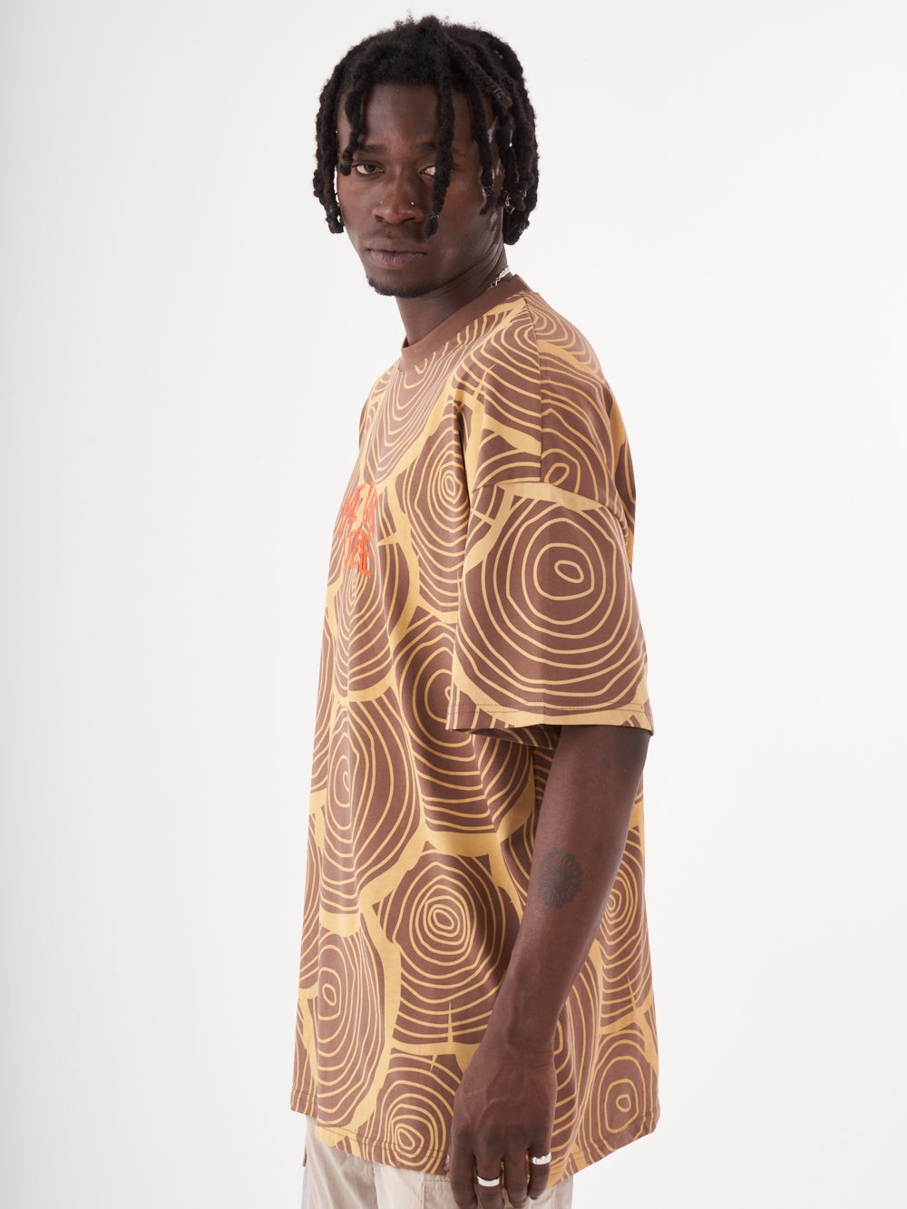 A man wearing a Steppe T-shirt.