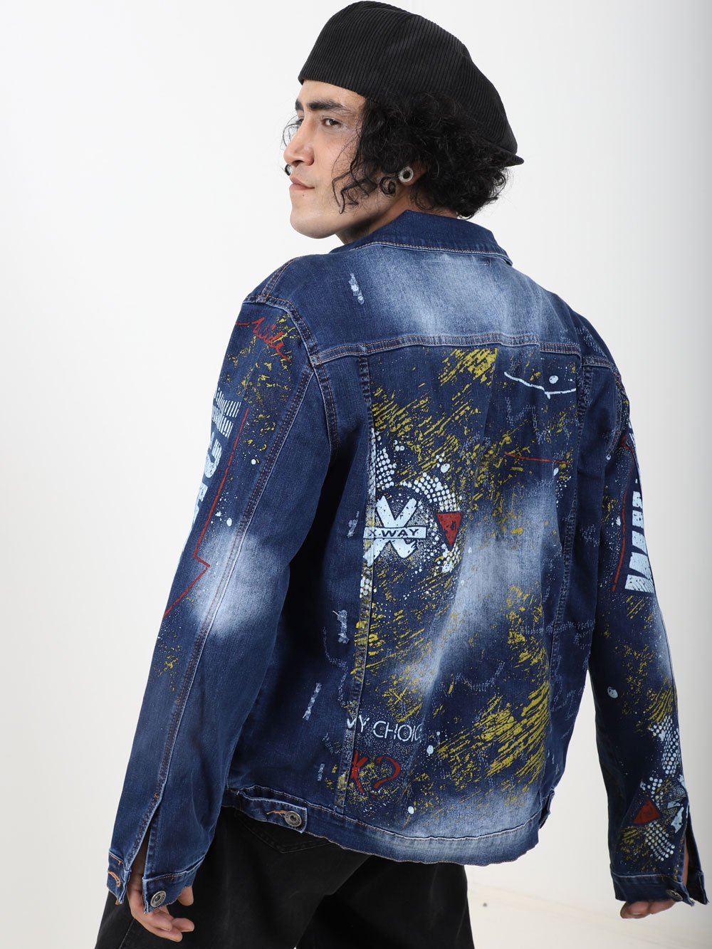 The back of a man wearing an OLD PAINTING denim jacket.