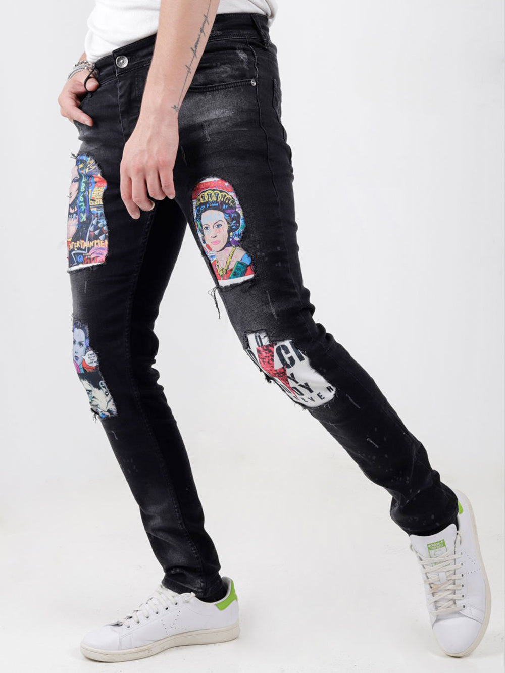 A man wearing a pair of MOONLISA jeans with patches on them.