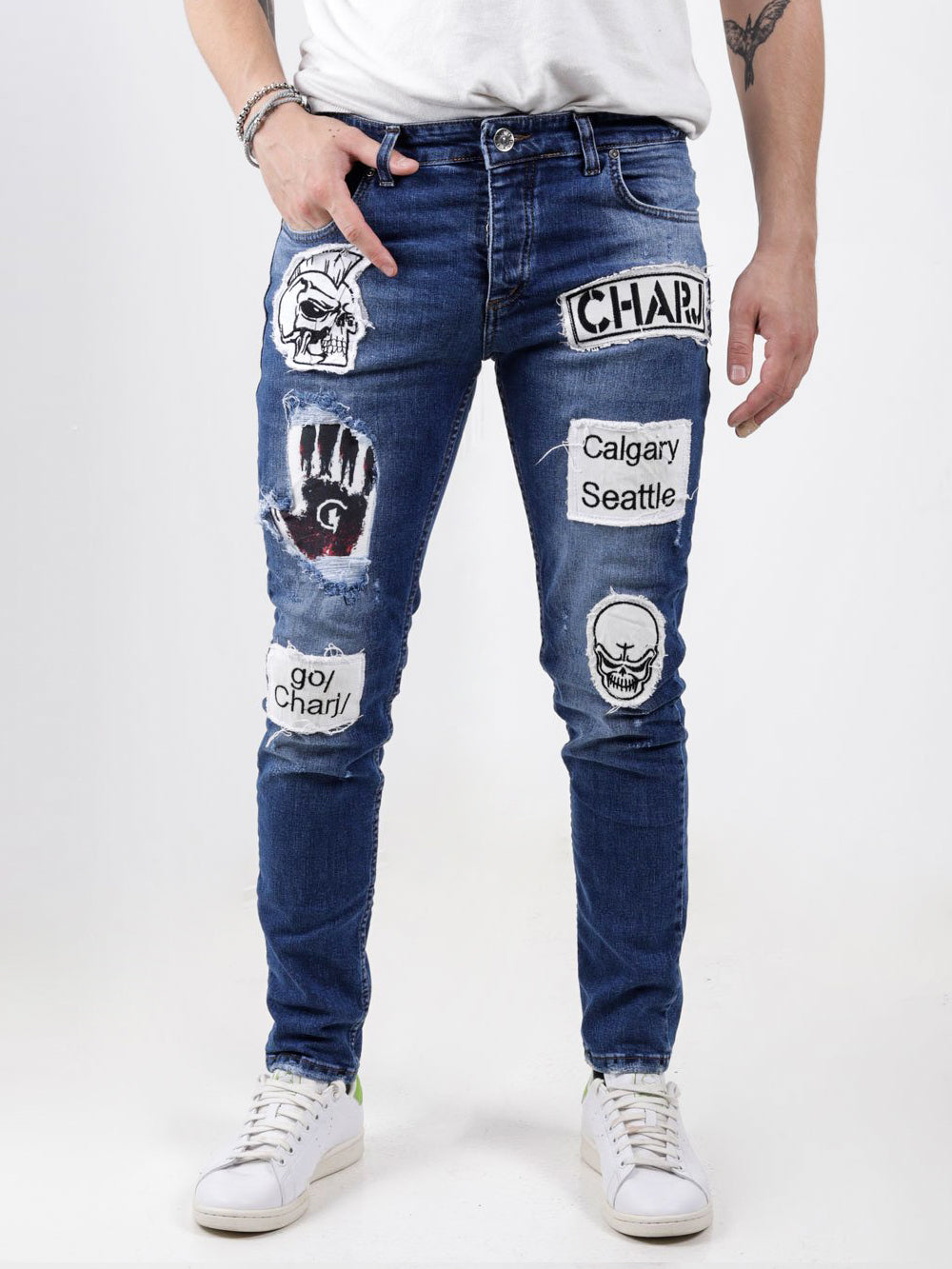 A man wearing a HEADSTONE with patches on them.