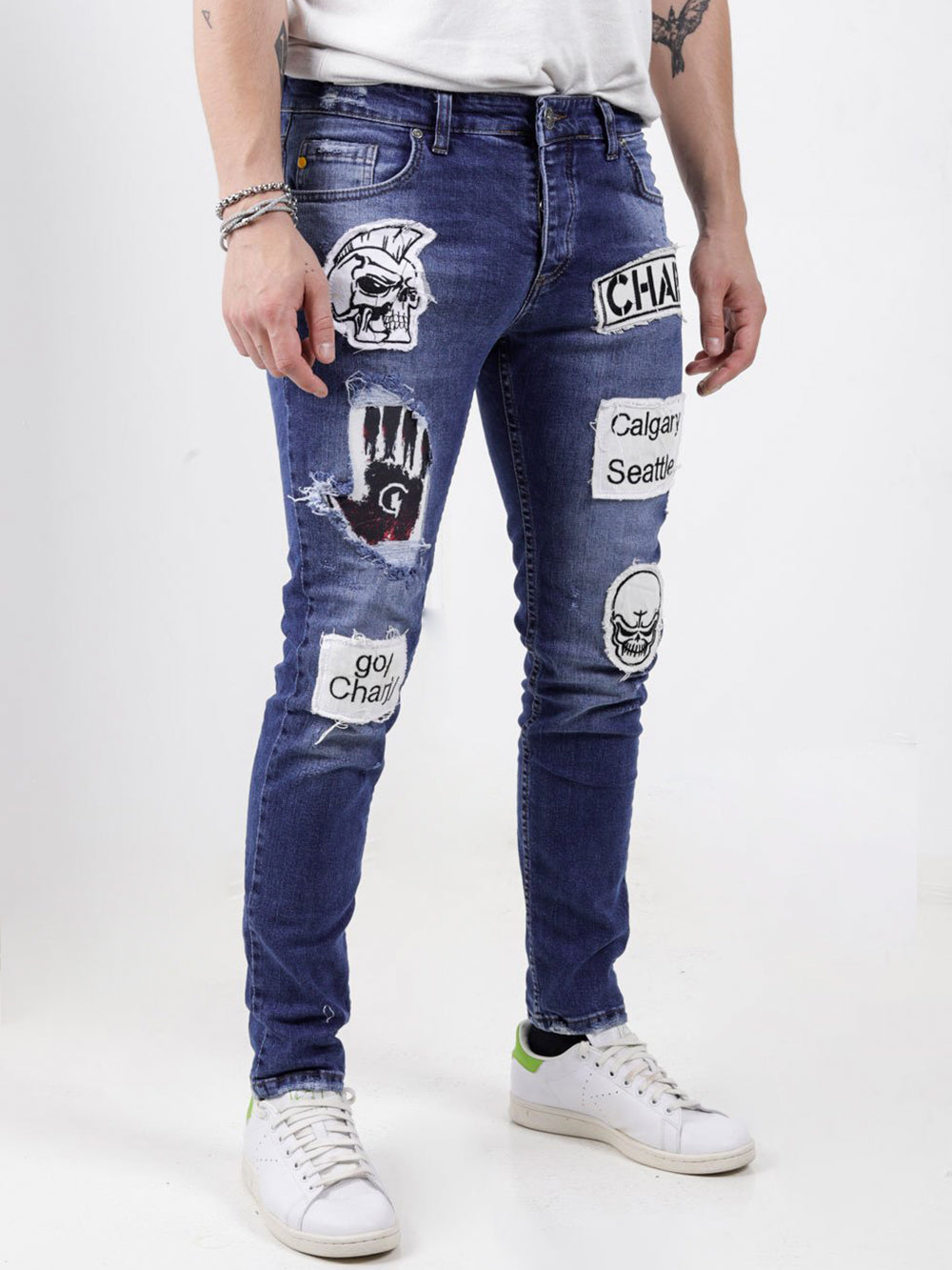 A man wearing a HEADSTONE with patches on them.