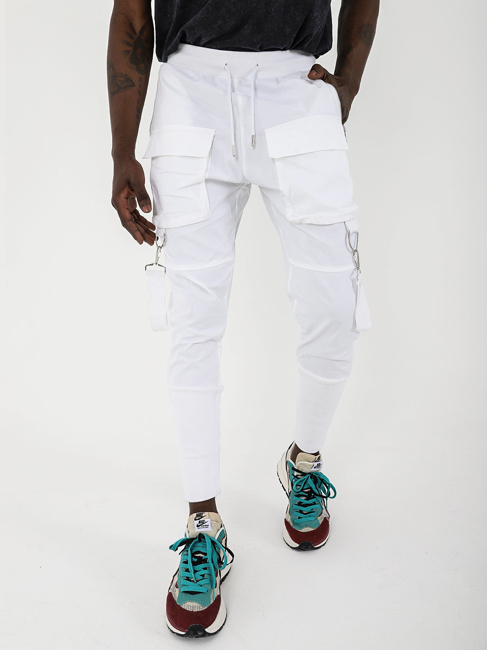 A man wearing BROOKLYN JOGGERS with adjustable drawstring waist and sneakers.