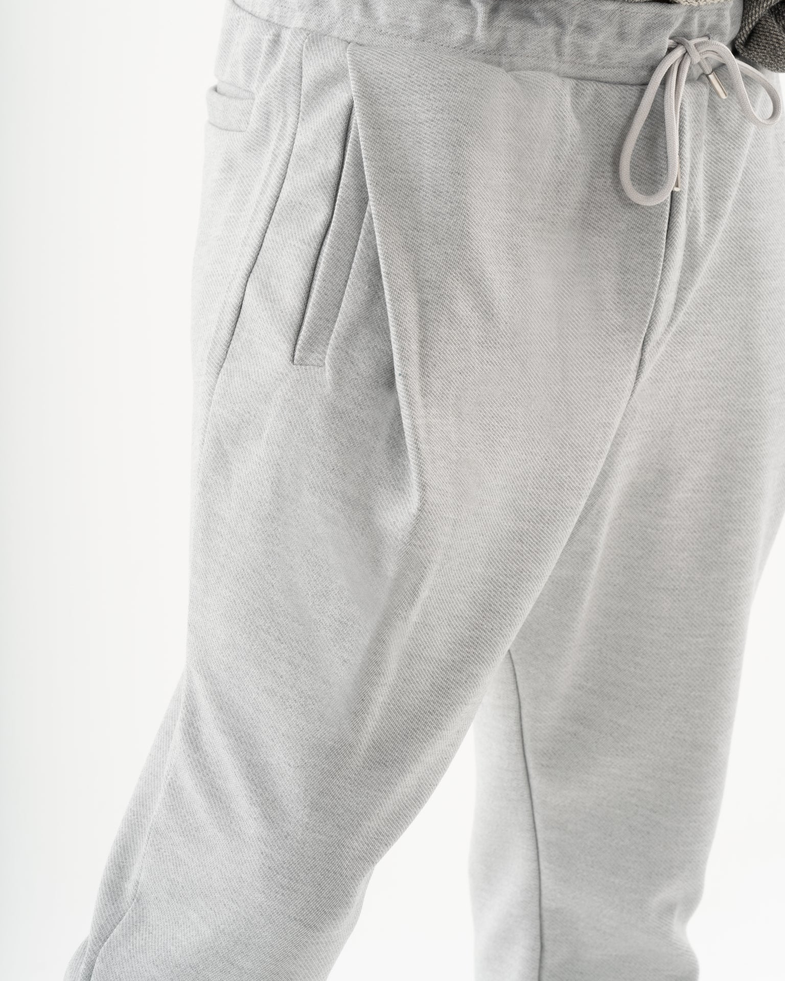 A man wearing SERENE JOGGERS for everyday wear.