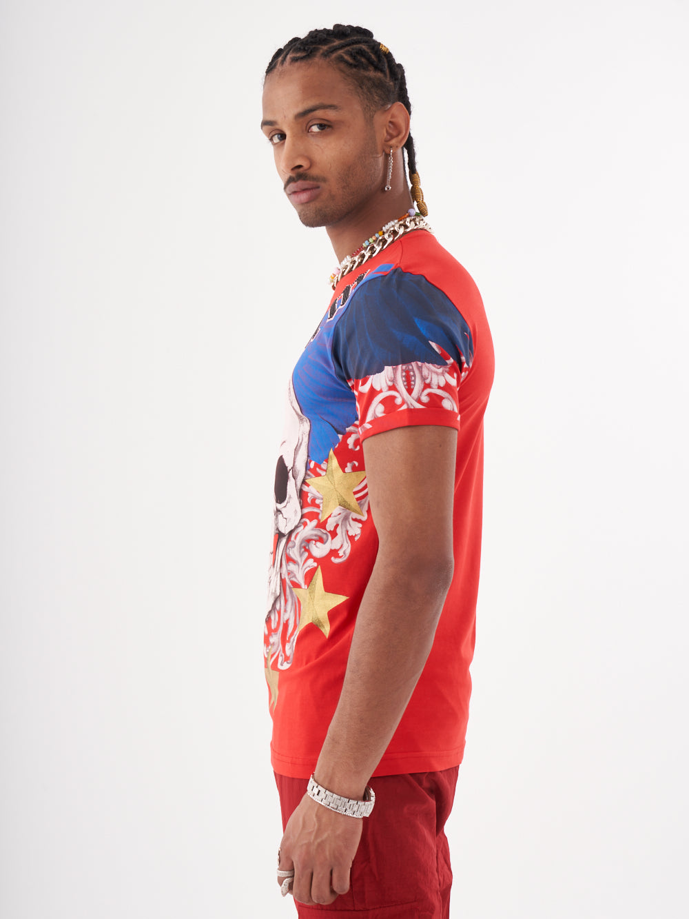 A man wearing the Euphoria t-shirt | red with a skeleton print.