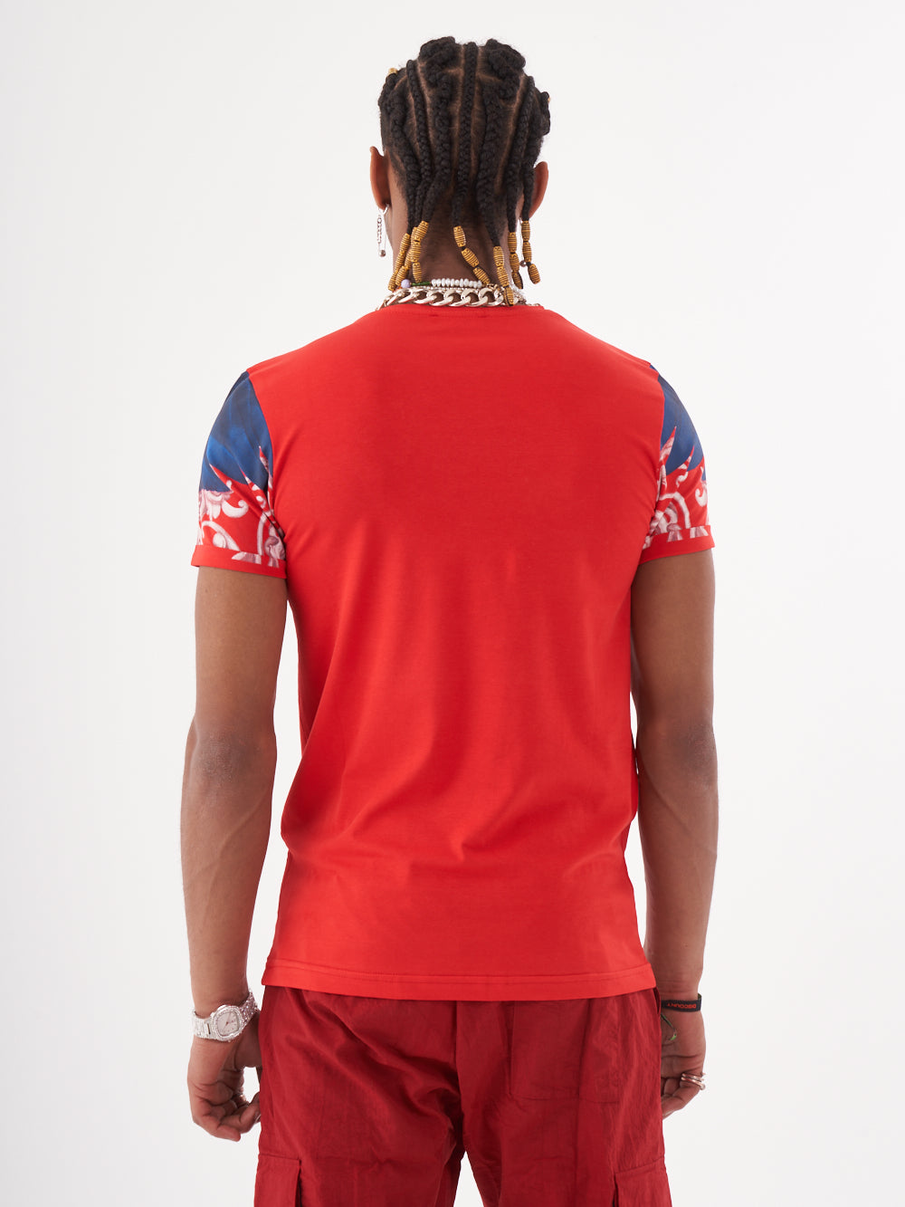 The back view of a man wearing the EUPHORIA T-SHIRT | RED with a skeleton print.