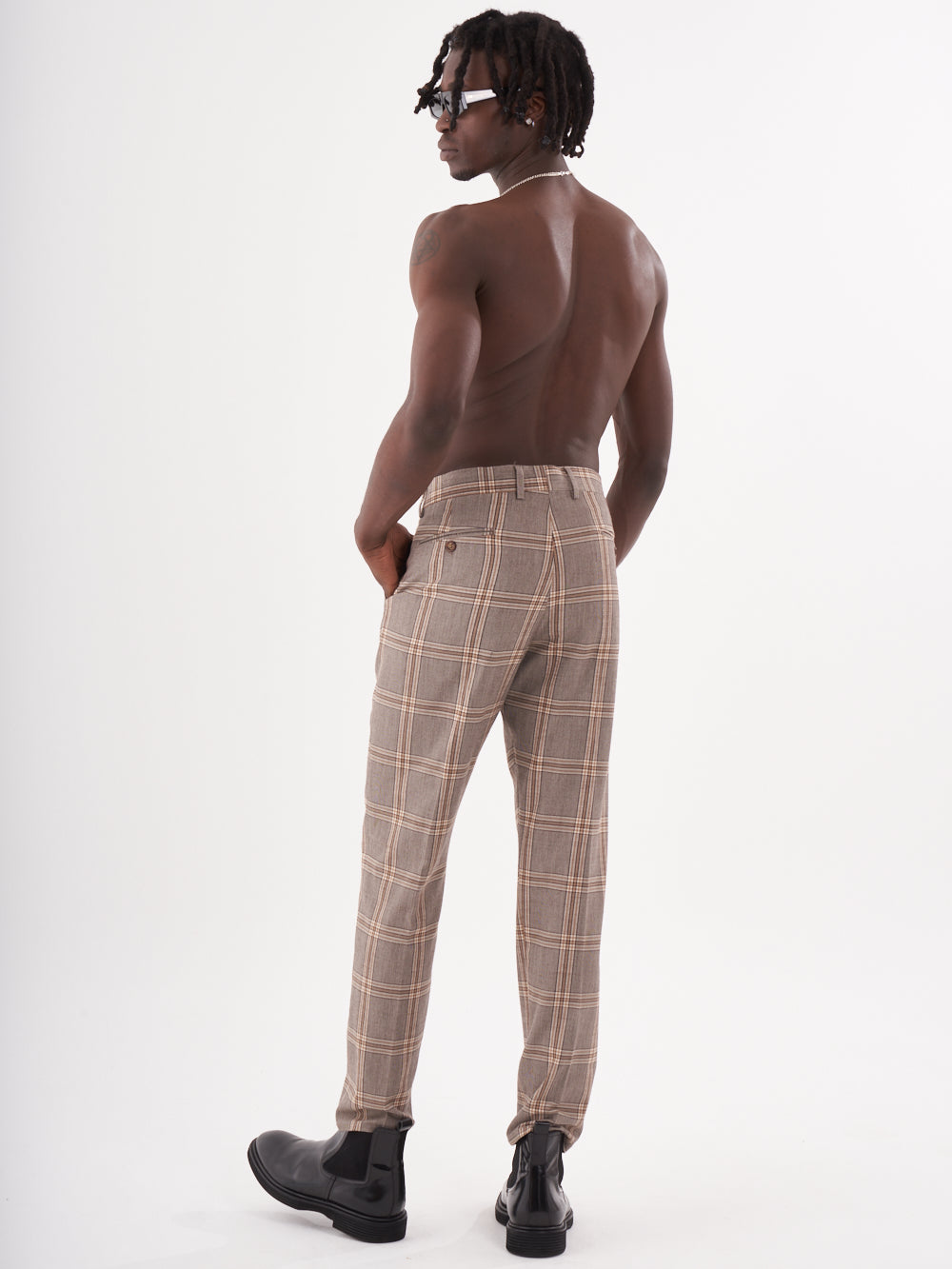 The back of a man wearing slim-fit ROOK PANTS.