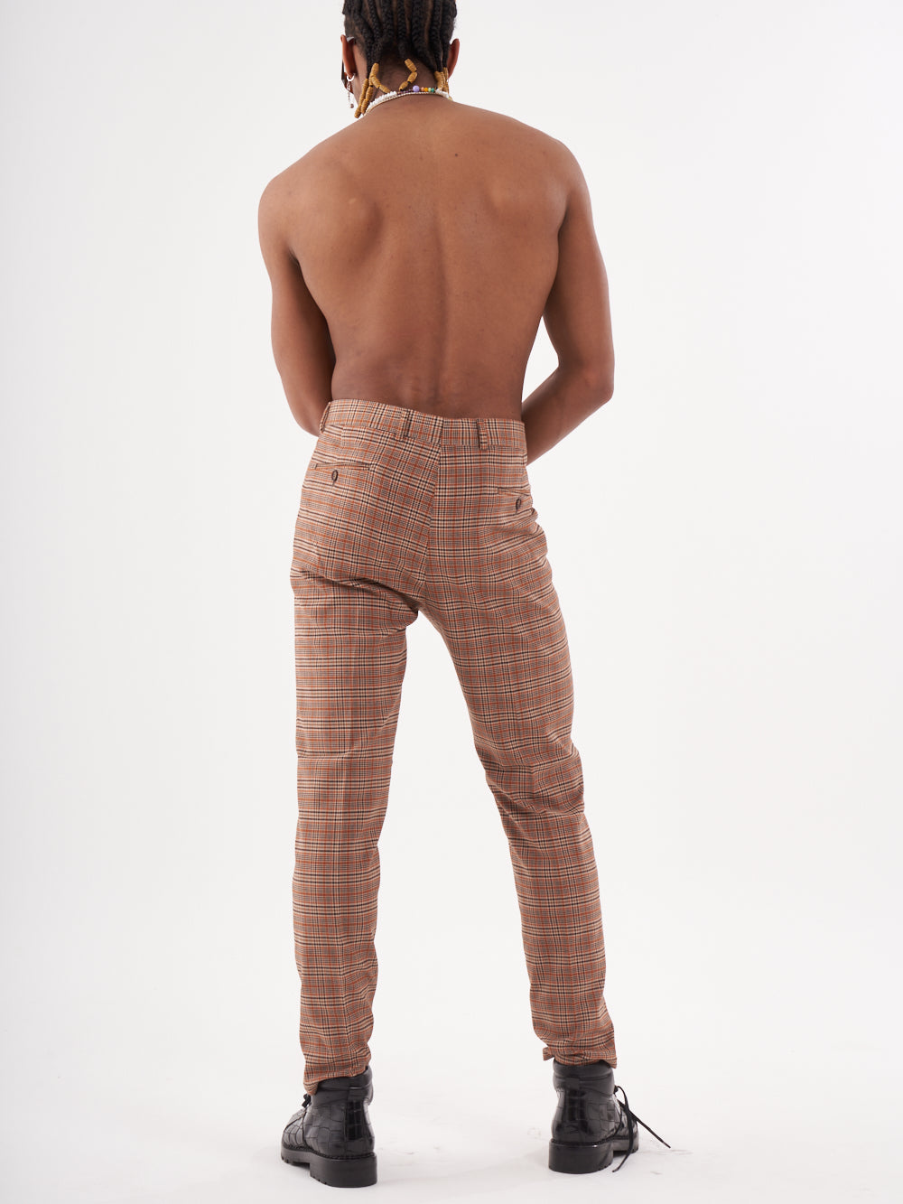 The back view of a man wearing SAWDUST PANTS.