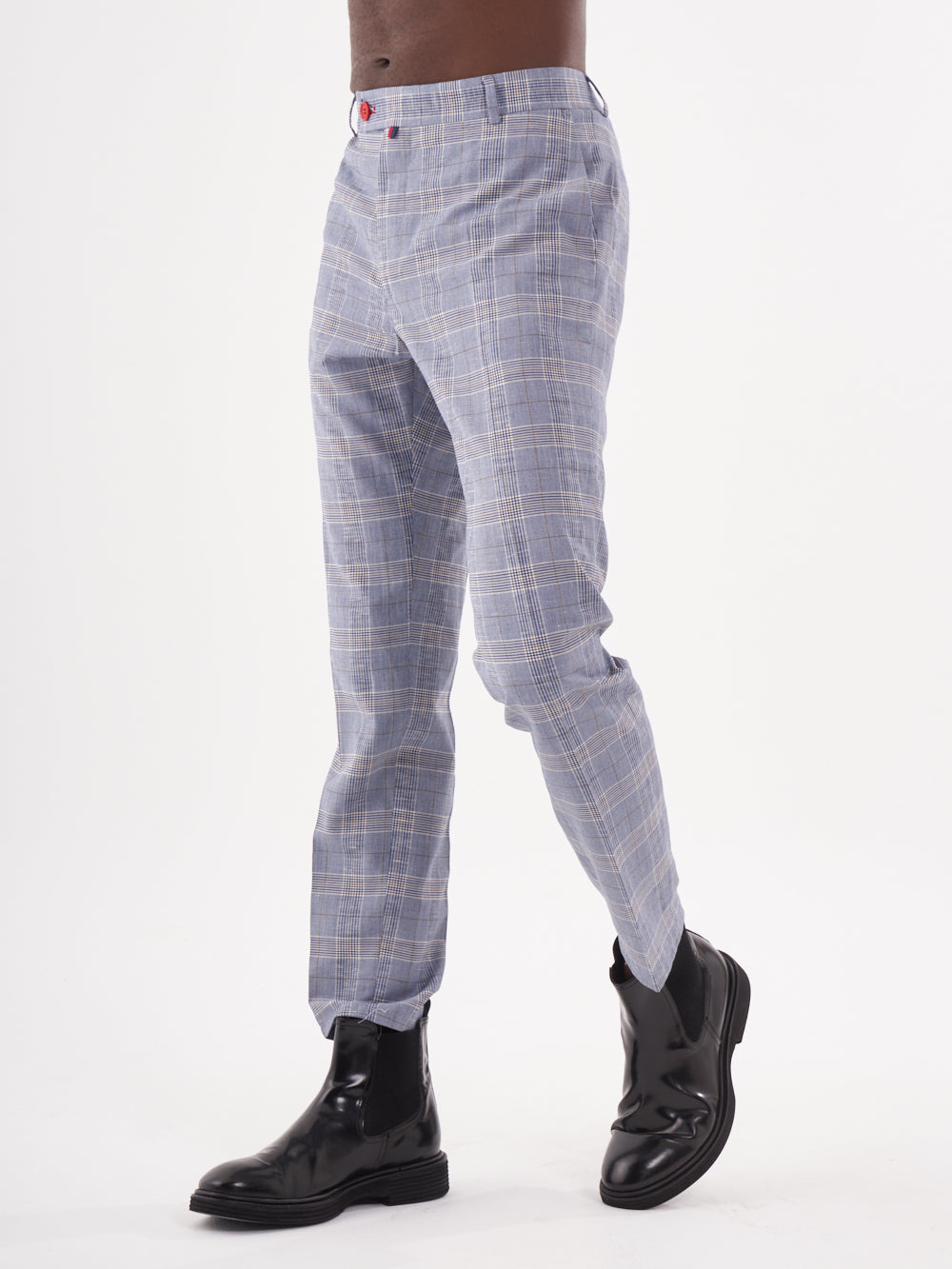 A man wearing Moraine Pants, a blue and white checkered pant.