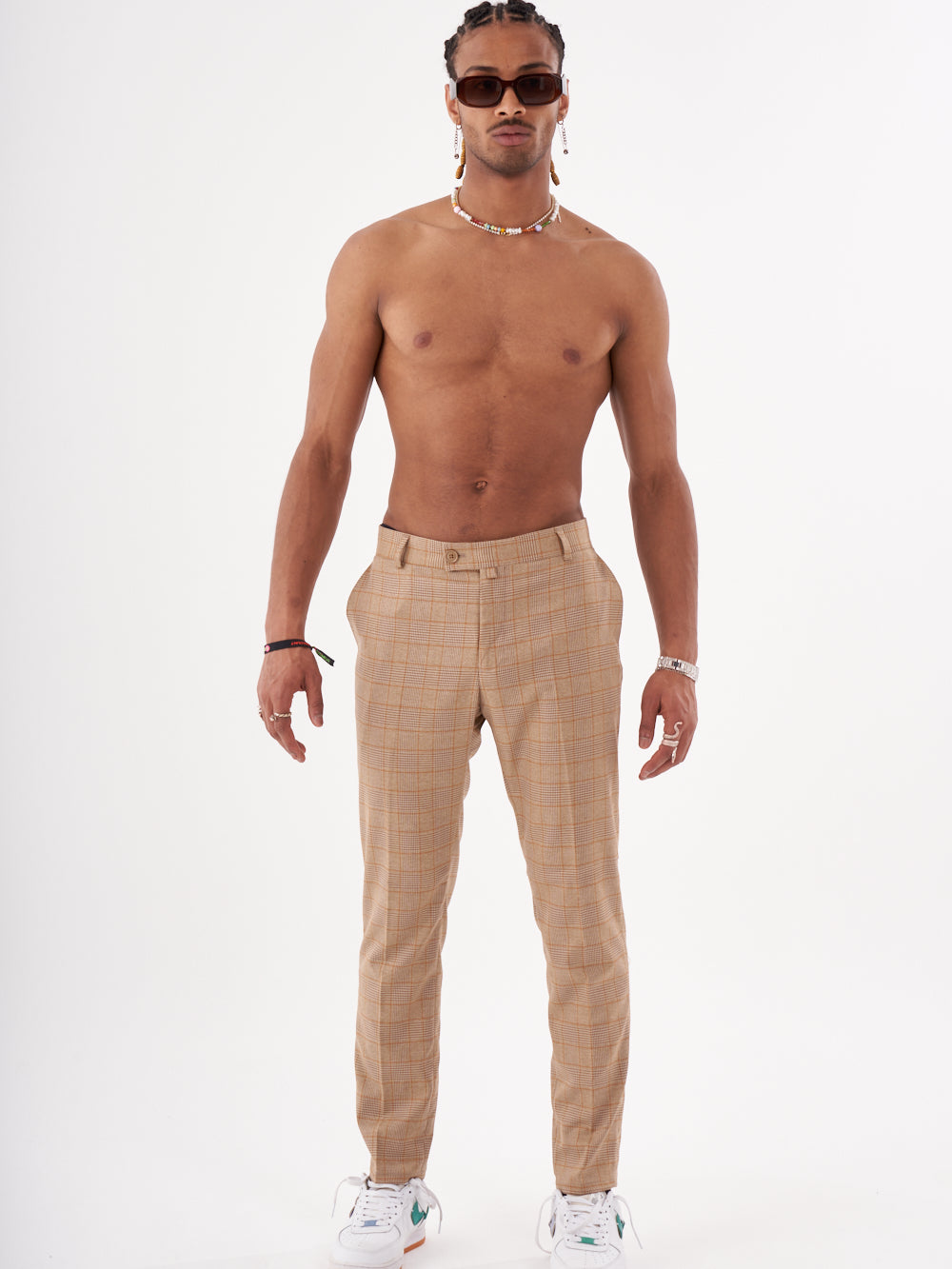 A man in a BAROT PANTS posing for a photo.