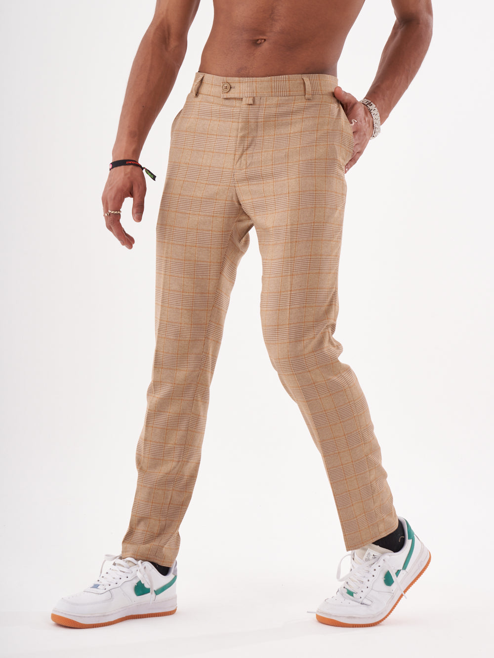 A man in a Barot pants posing for a photo.