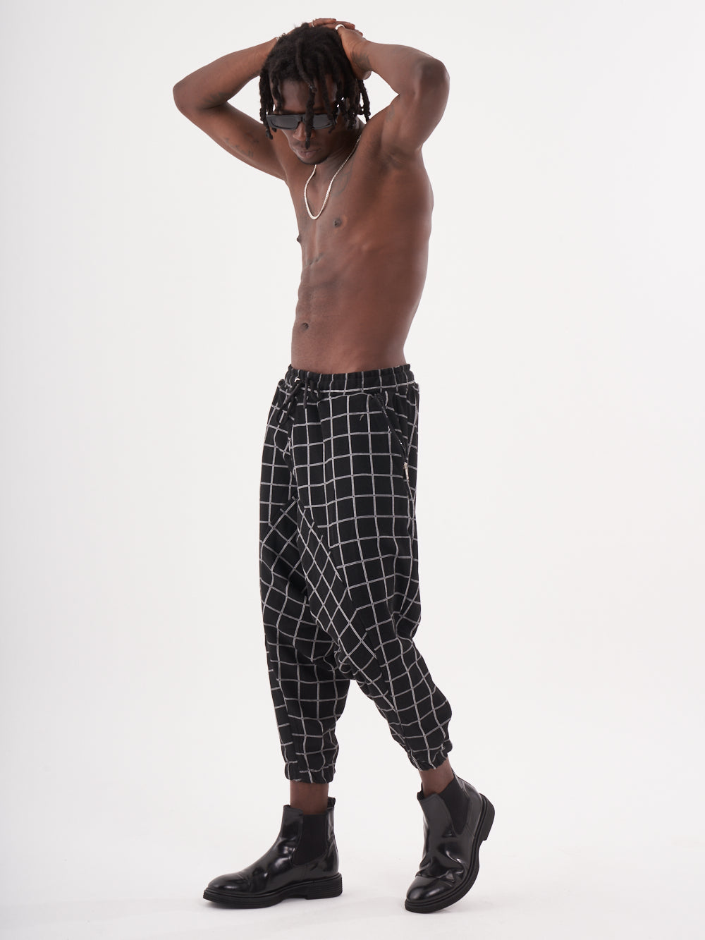 A man wearing WACKADOO JOGGERS, also known as Harem Pants.