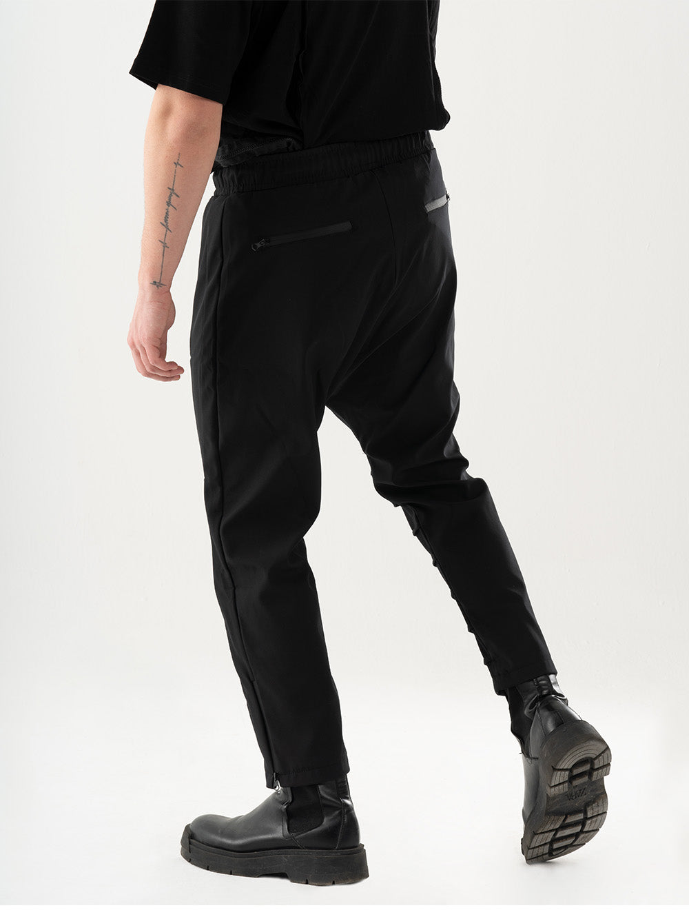 A man wearing an Invogue joggers t-shirt and Invogue joggers pants.