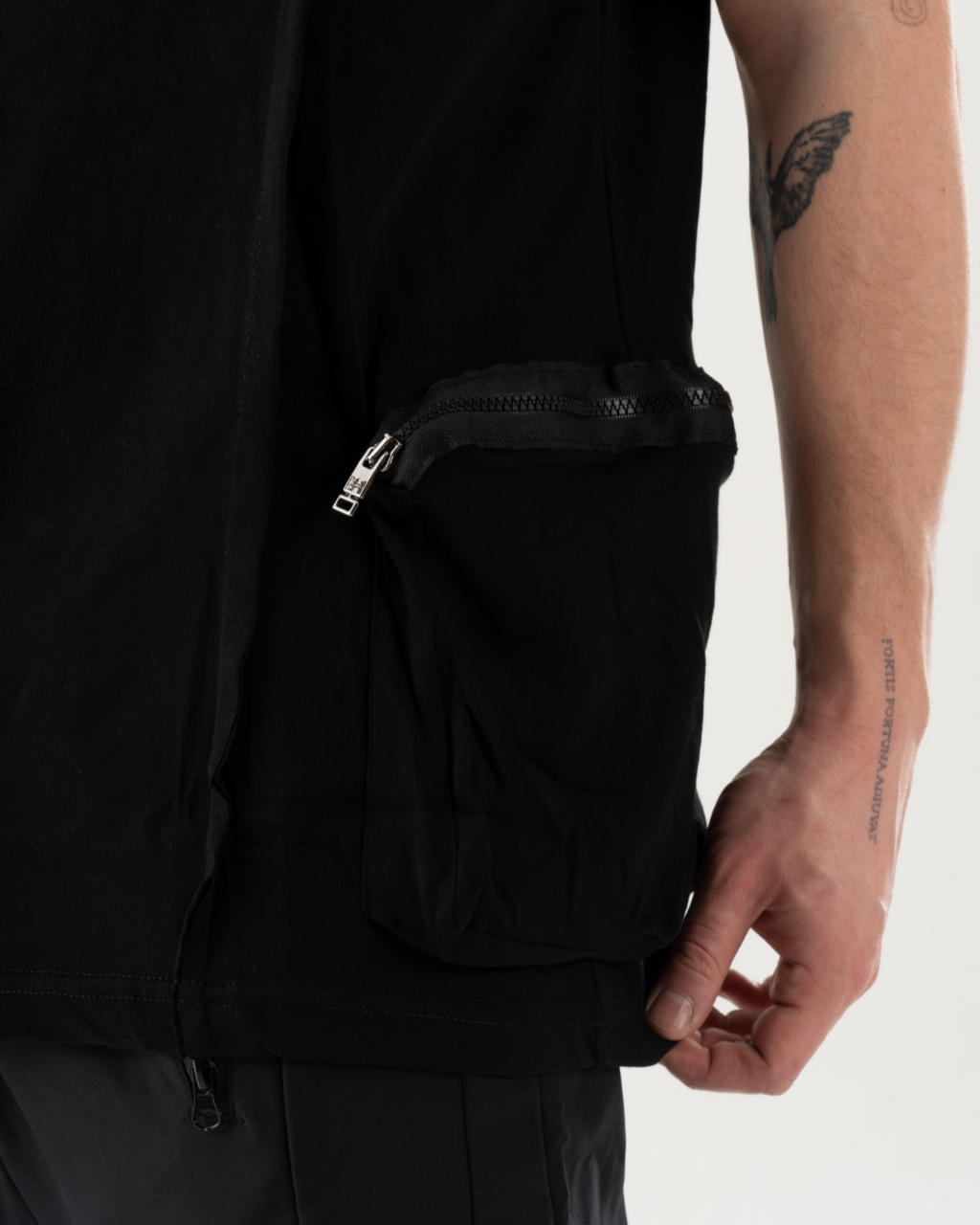 The back of a man wearing a BLACKFURY HOODIE with a zipper pocket in stylish hoodie.