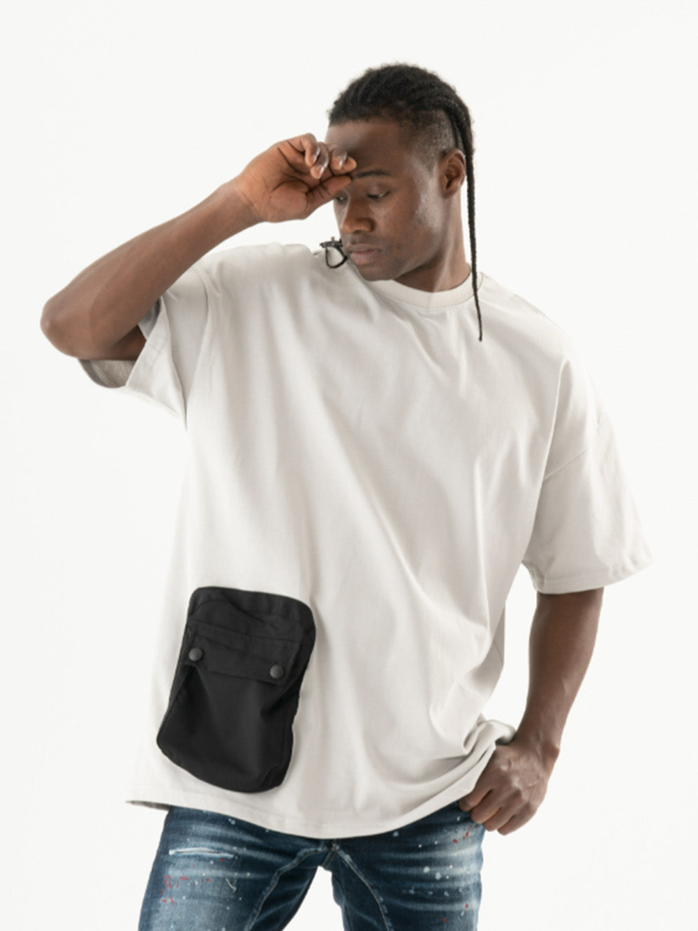 A man wearing an ELEVATE T-SHIRT with a black pocket.