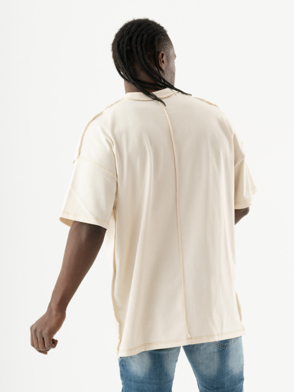 The back of a man wearing a MENTALIST T-SHIRT | BEIGE.