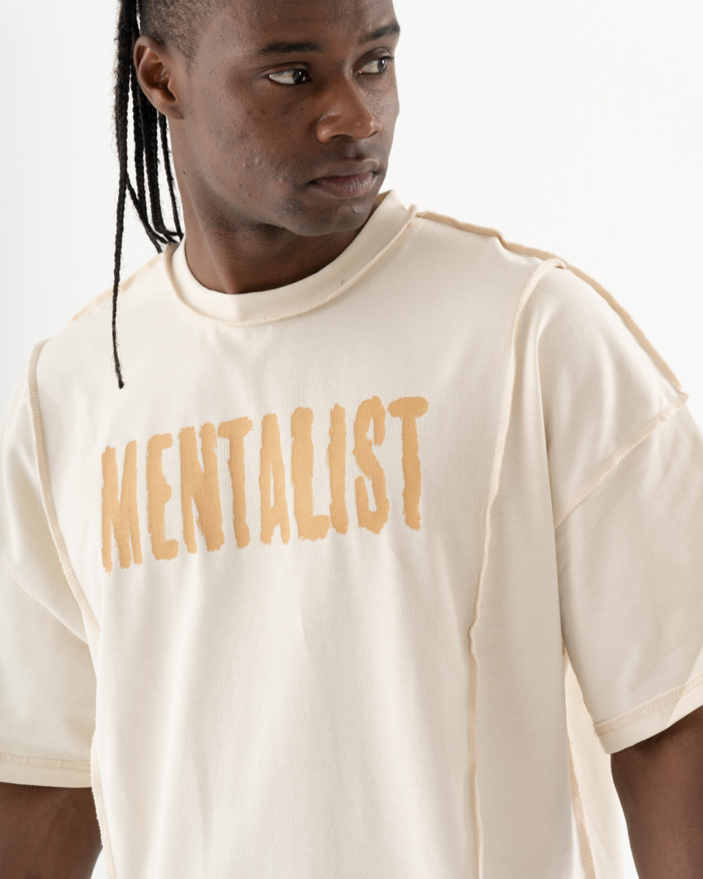 A man wearing a Mentalist T-Shirt | Beige.