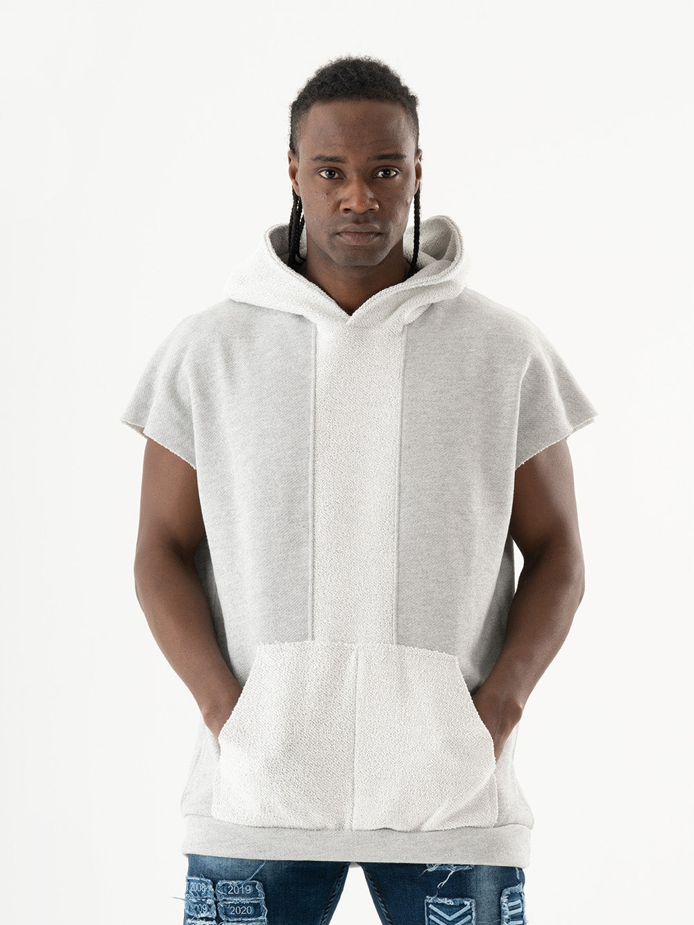 A man wearing a BACHELOR HOODIE | WHITE with a pouch pocket.