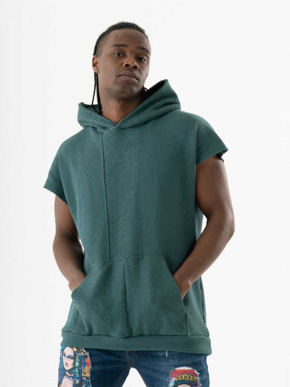 A man wearing a BACHELOR HOODIE | GREEN with a pouch pocket.