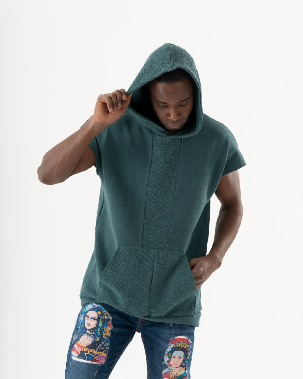 A man wearing a BACHELOR HOODIE | GREEN with a pouch pocket.