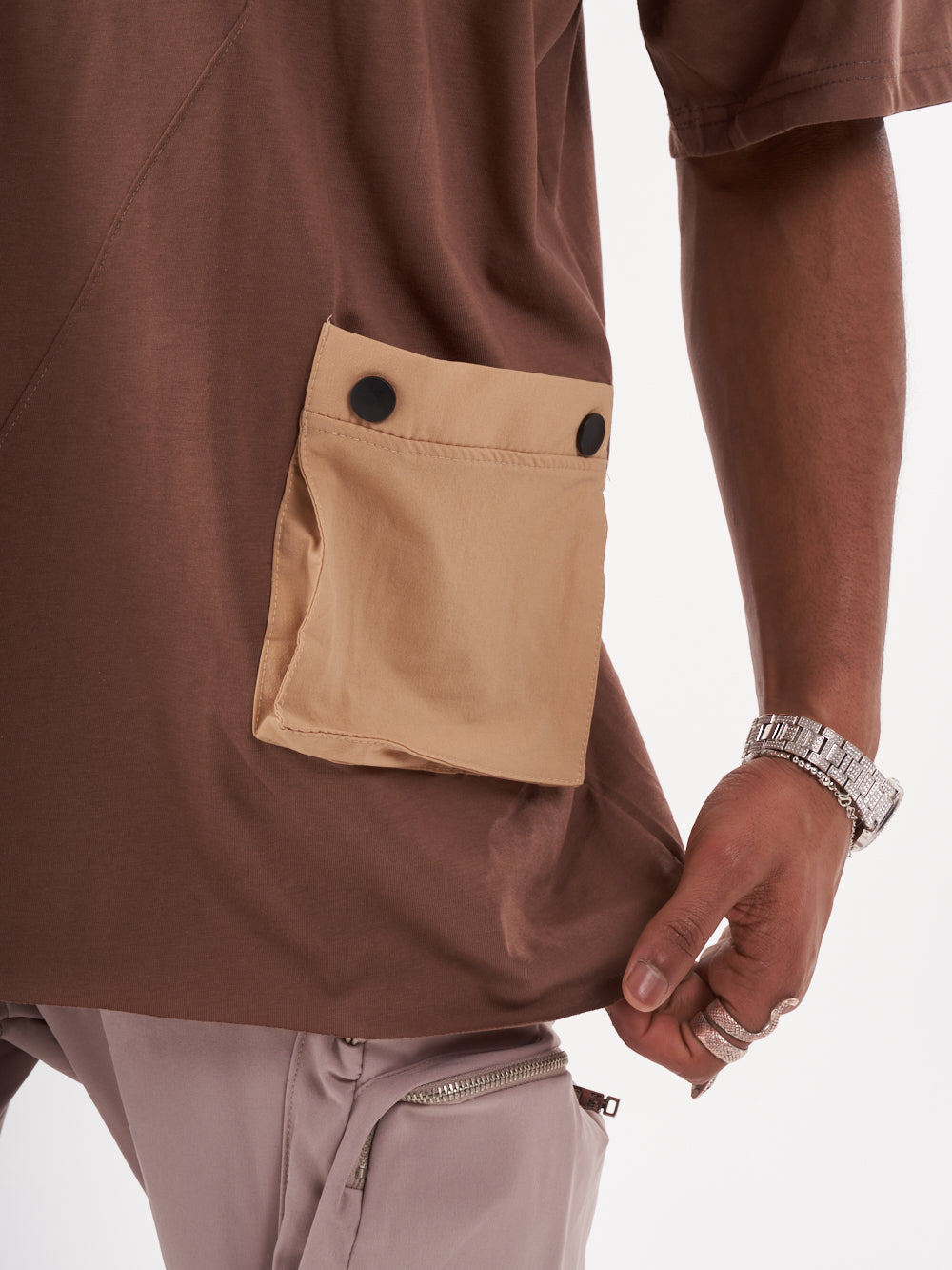 A man wearing a BEATNIK T-SHIRT with a brown pocket.