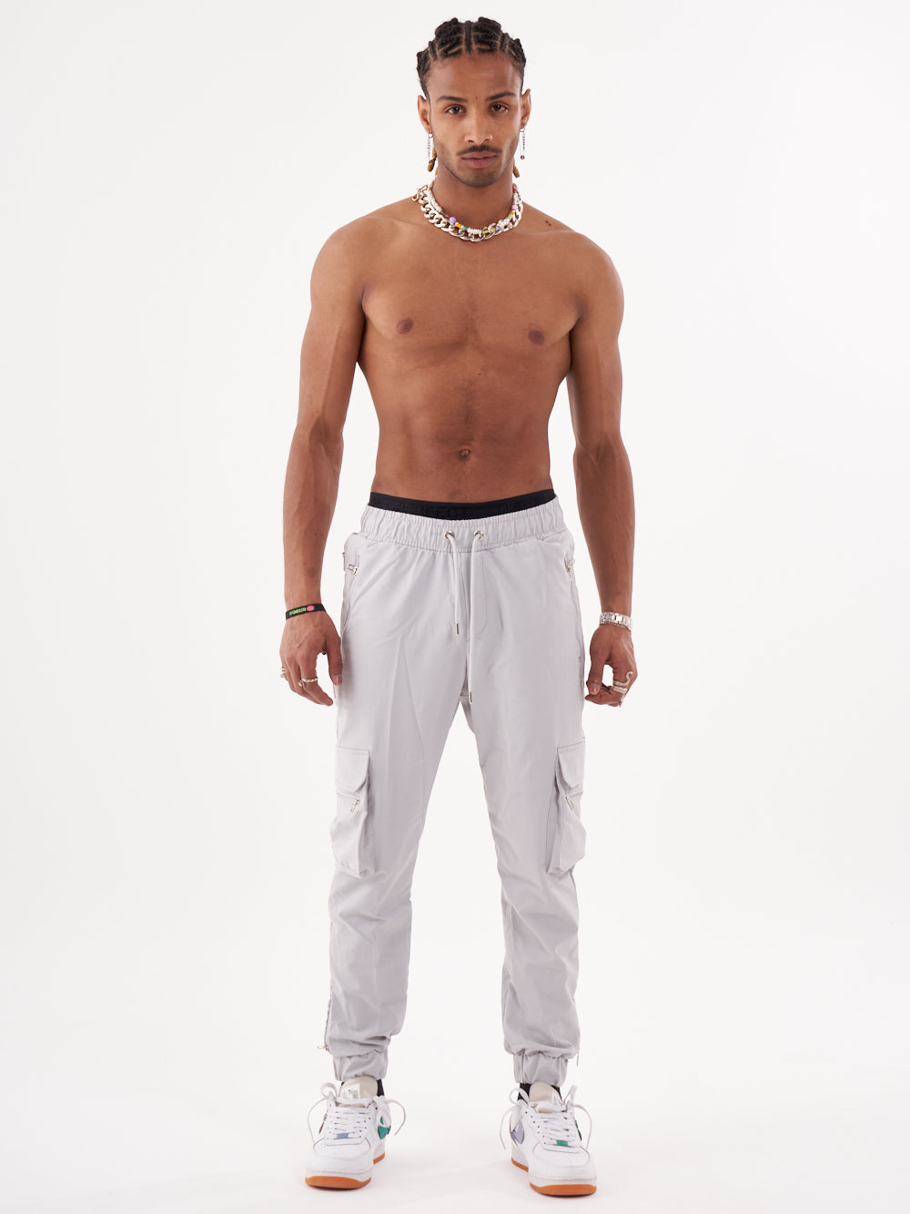 A man in ANARCHY JOGGERS posing in front of a white background.