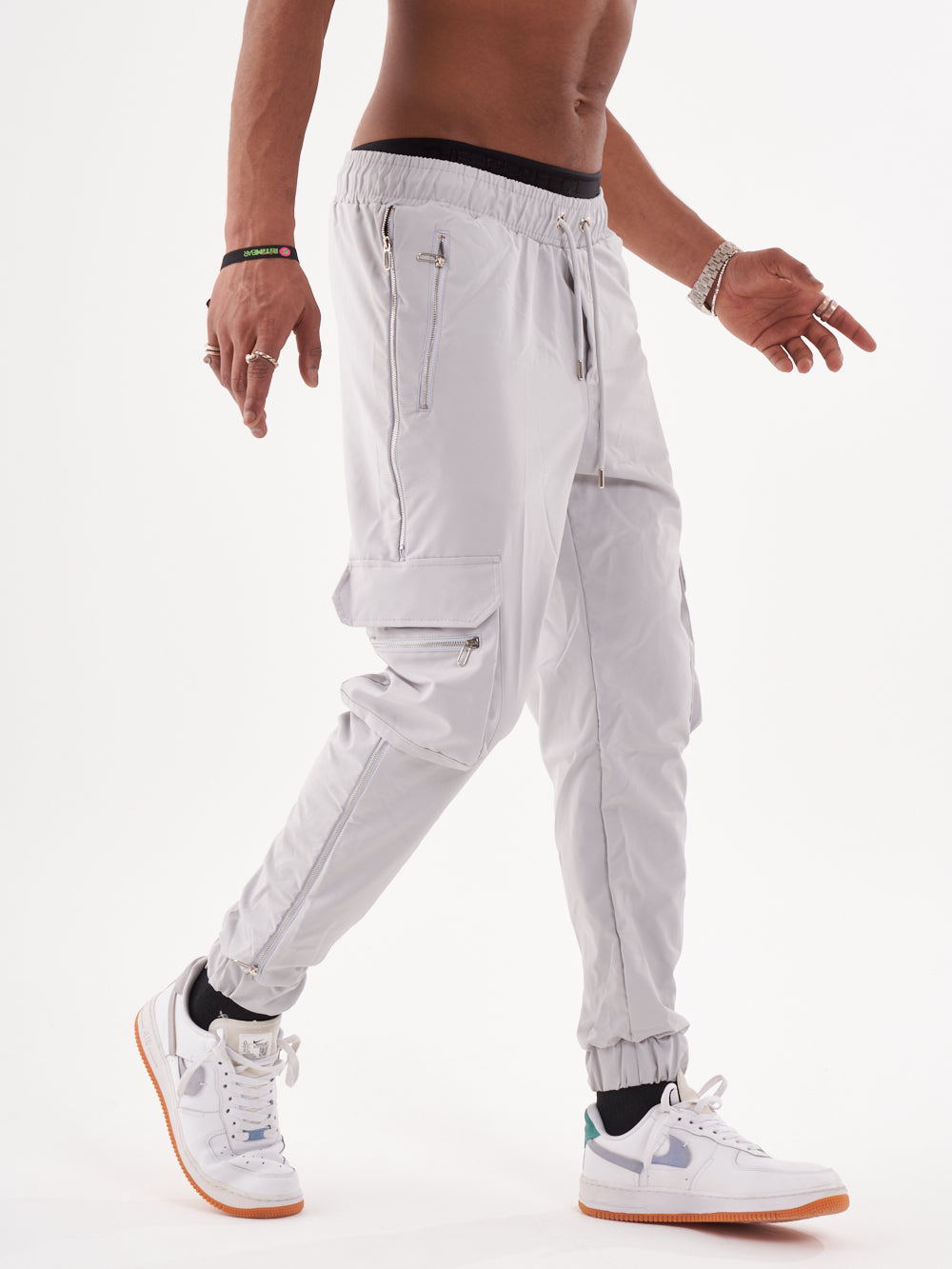 A man wearing a pair of ANARCHY JOGGERS and sneakers.