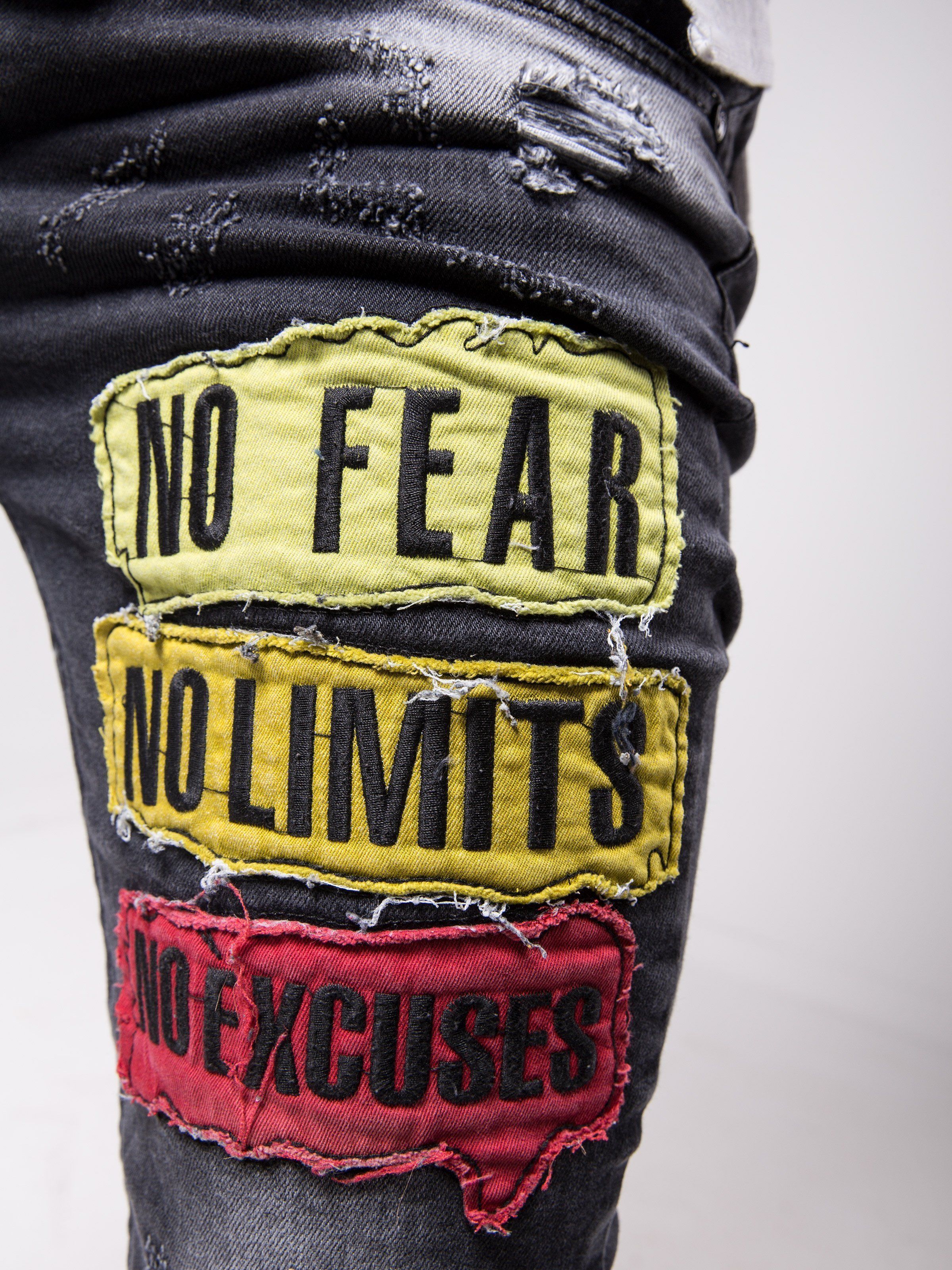 A pair of FEARLESS skinny fit jeans with a patch that says no fear no limits.