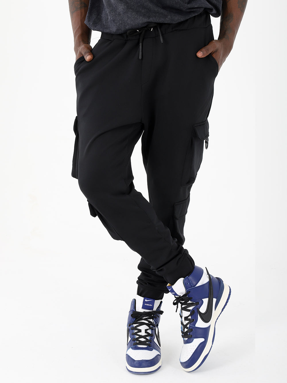 A man in VENTURA JOGGERS with adjustable ankle cuffs posing for a photo.