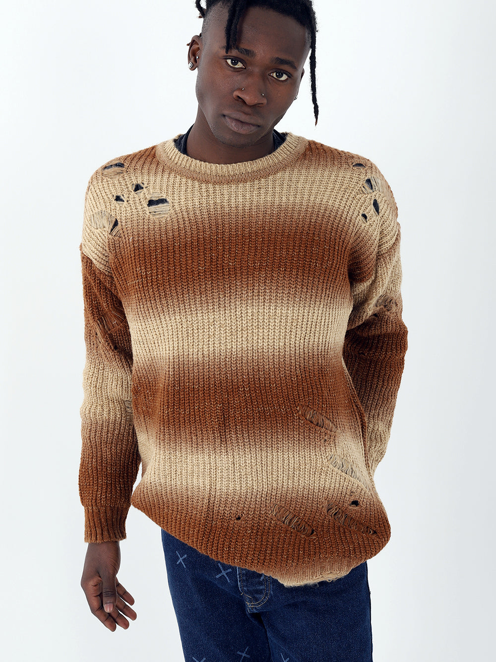 A man wearing the Distressed Gentleman Sweater | Brown, true to size.