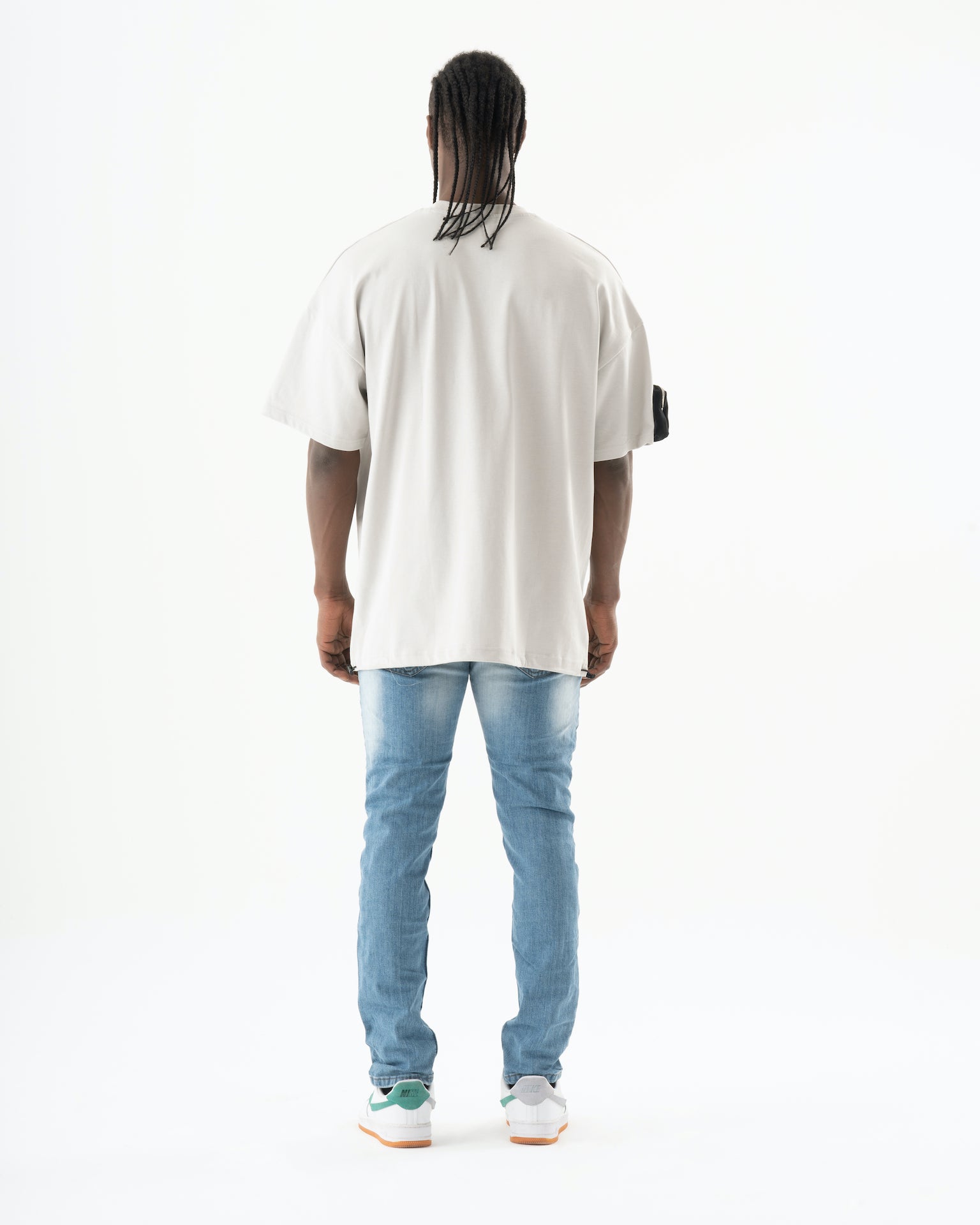 The back view of a man wearing the SKATER Jeans.