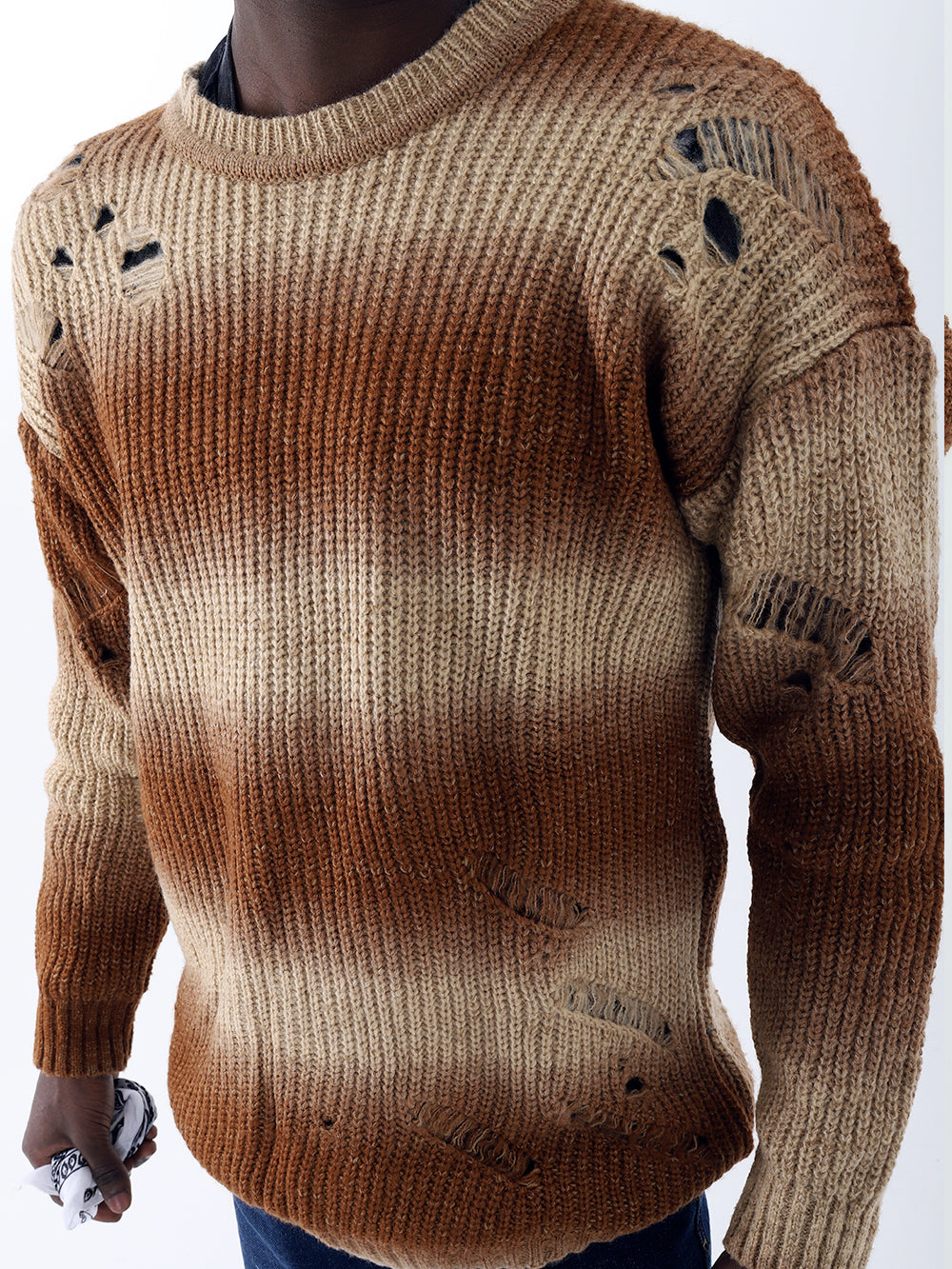 A man wearing a Distressed Gentleman Sweater in brown and tan made of acrylic.