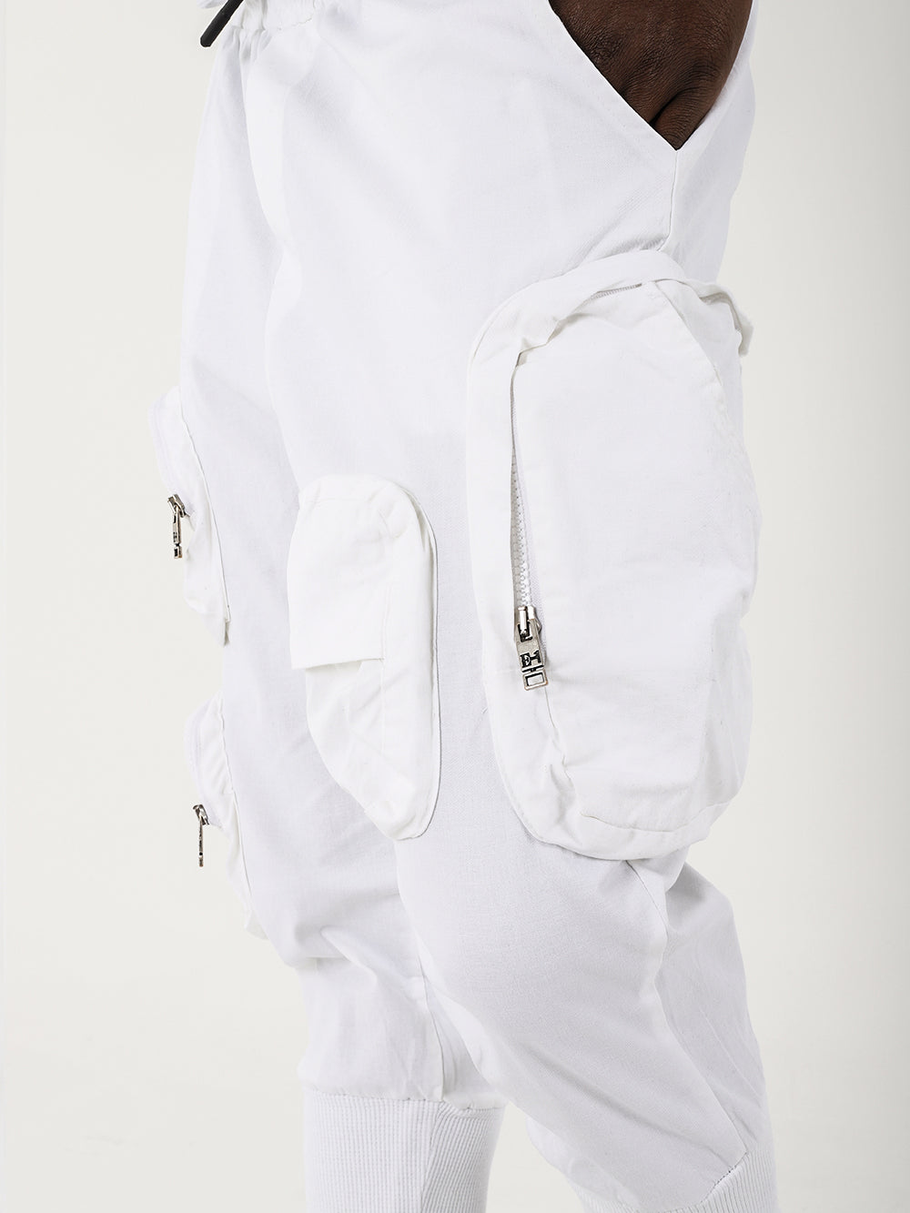 The back of a man wearing white STERLING JOGGERS with adjustable drawstring waist.