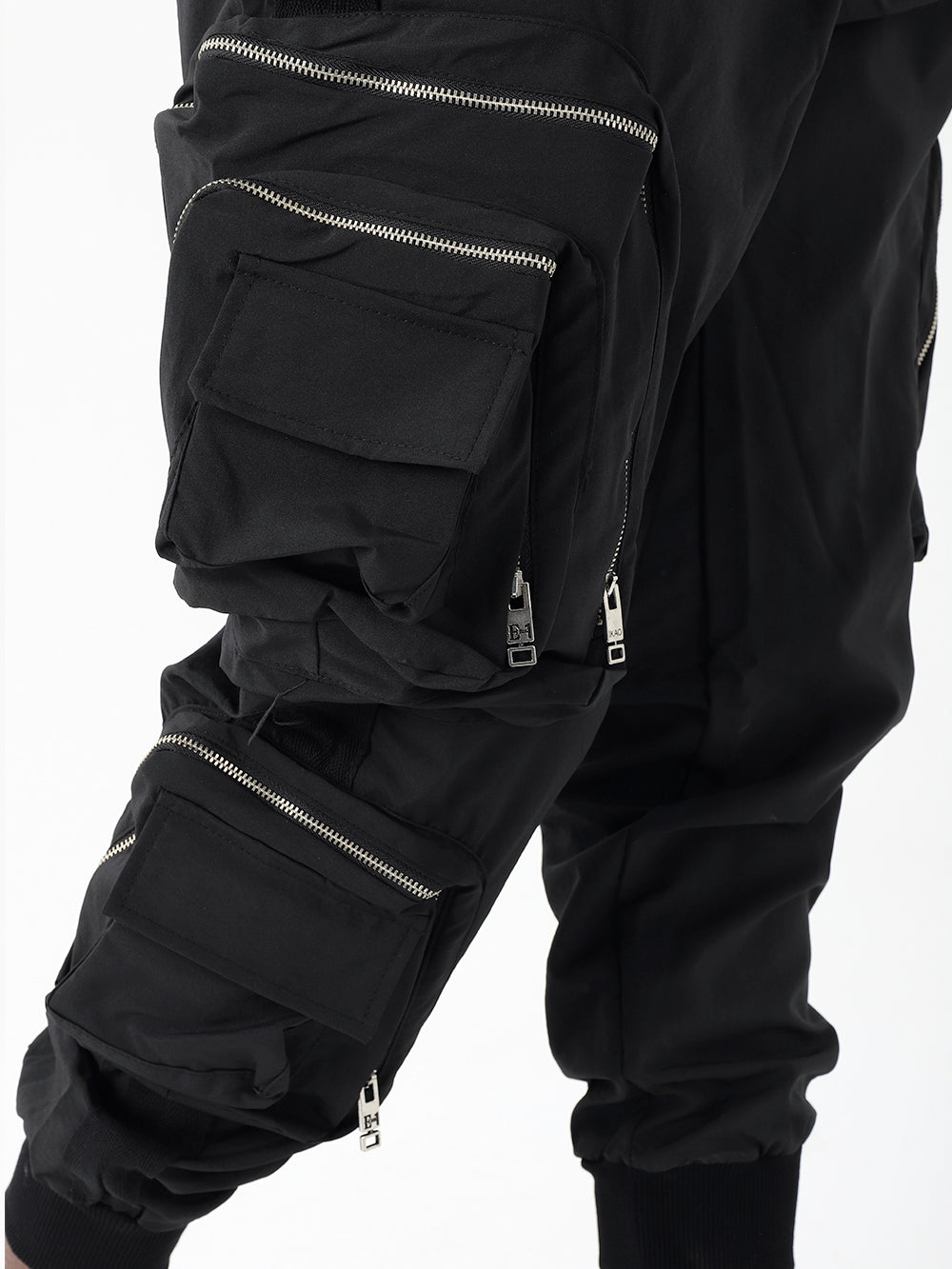A man wearing LAVANO JOGGERS with zippered pockets.