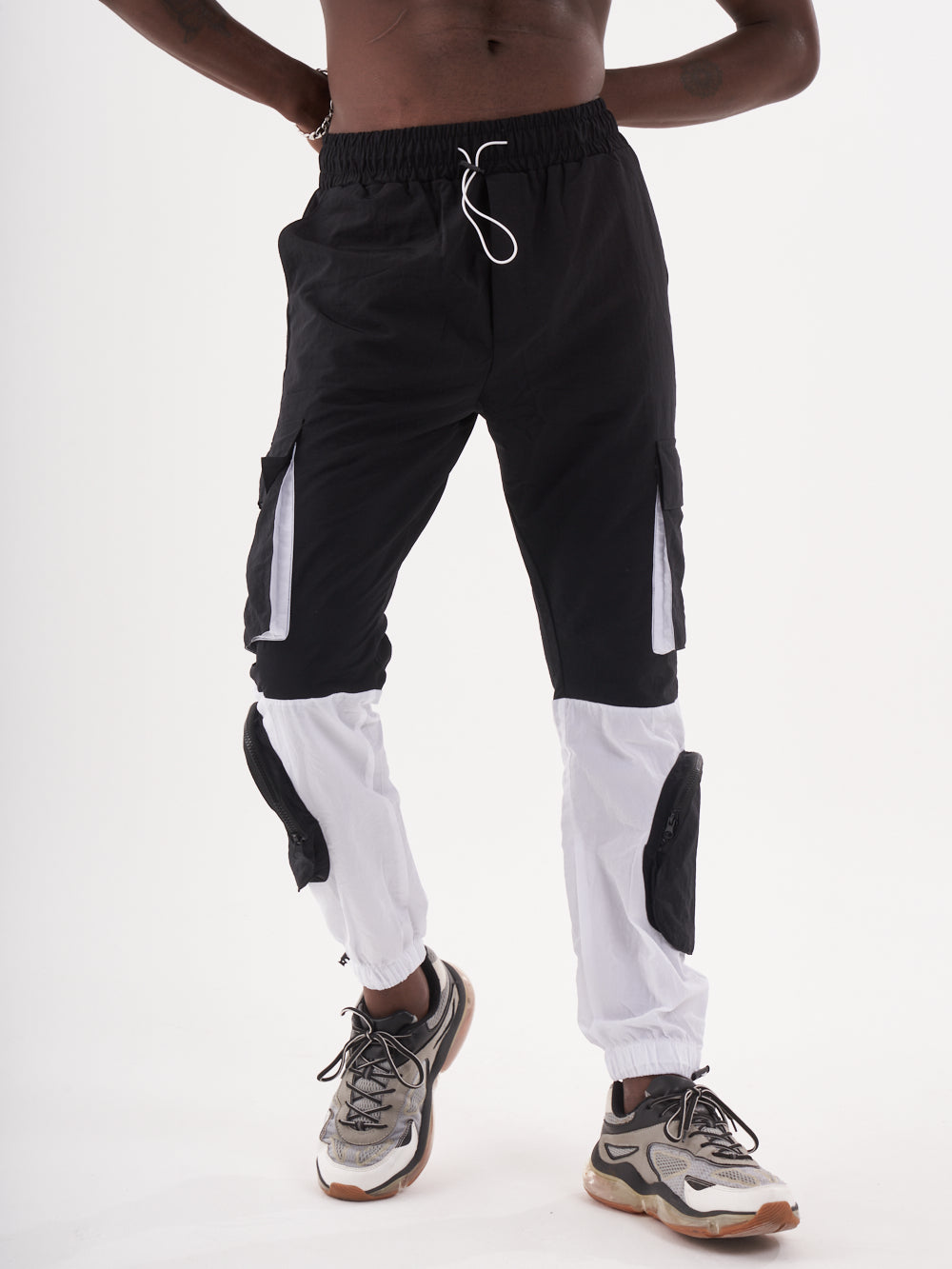 A man wearing the RENEGADE | BLACK cargo pants.