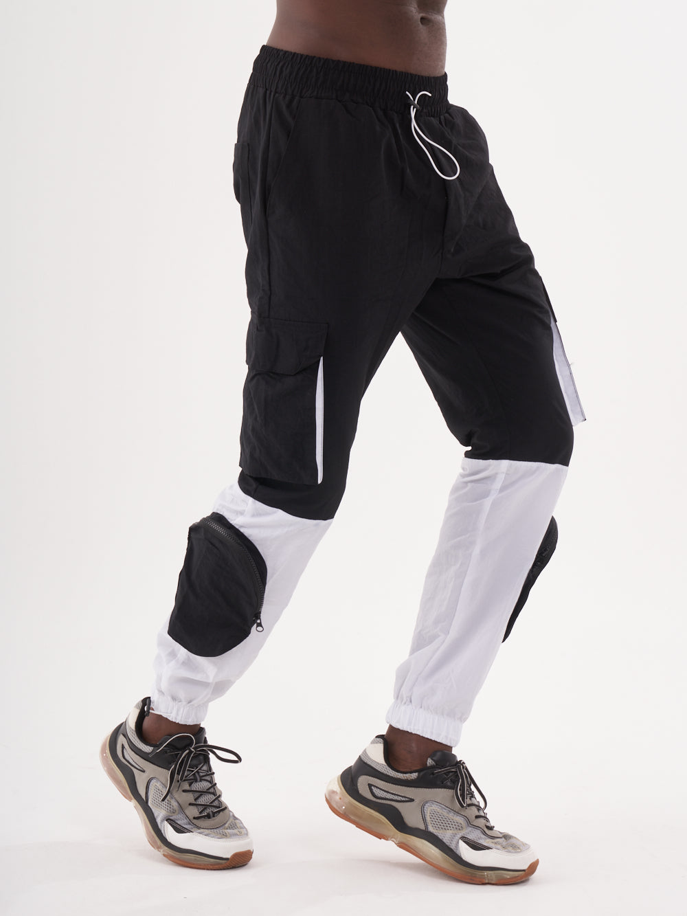 A man wearing RENEGADE | BLACK cargo joggers.