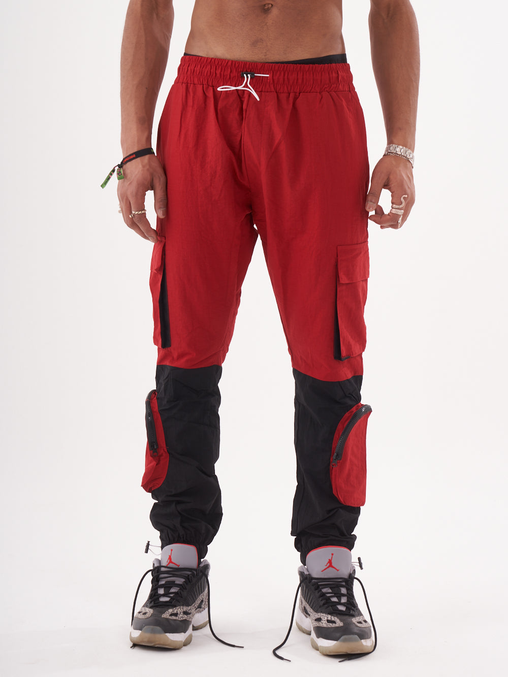 A man wearing RENEGADE | RED cargo pants.
