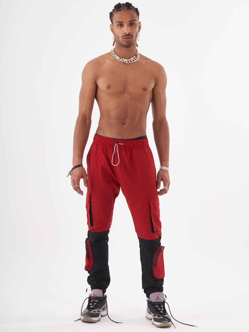 A man wearing the RENEGADE | RED joggers posing for a photo.