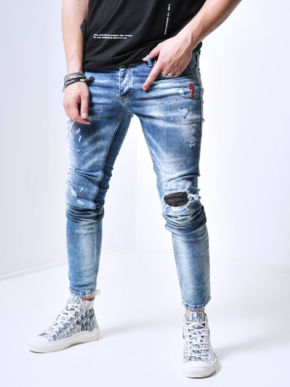 A man wearing the skinny fit streetwear jeans called THE SPECIAL ONE by SERNES