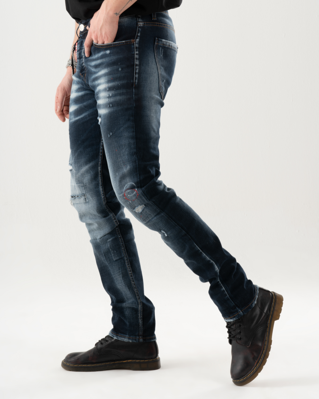 A man is standing in a studio wearing a pair of LIGHTNING skinny fit jeans.
