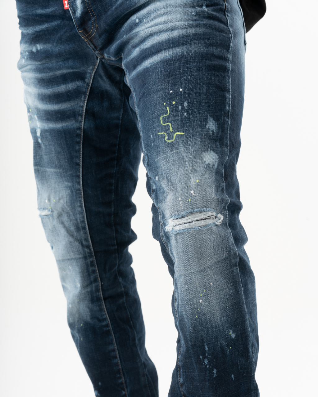 The back of a man wearing a pair of INCOGNITO jeans.