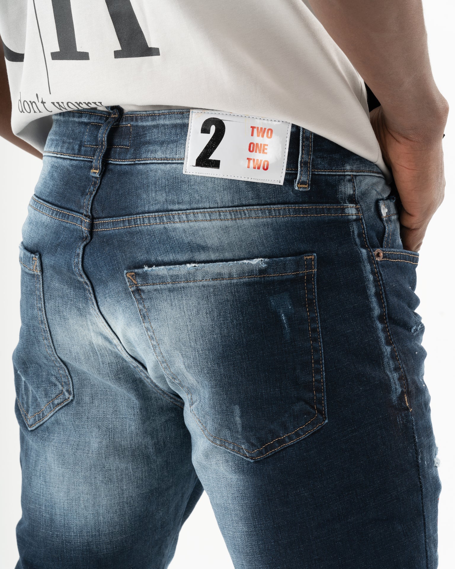 The back of a man wearing STARLIGHT jeans.