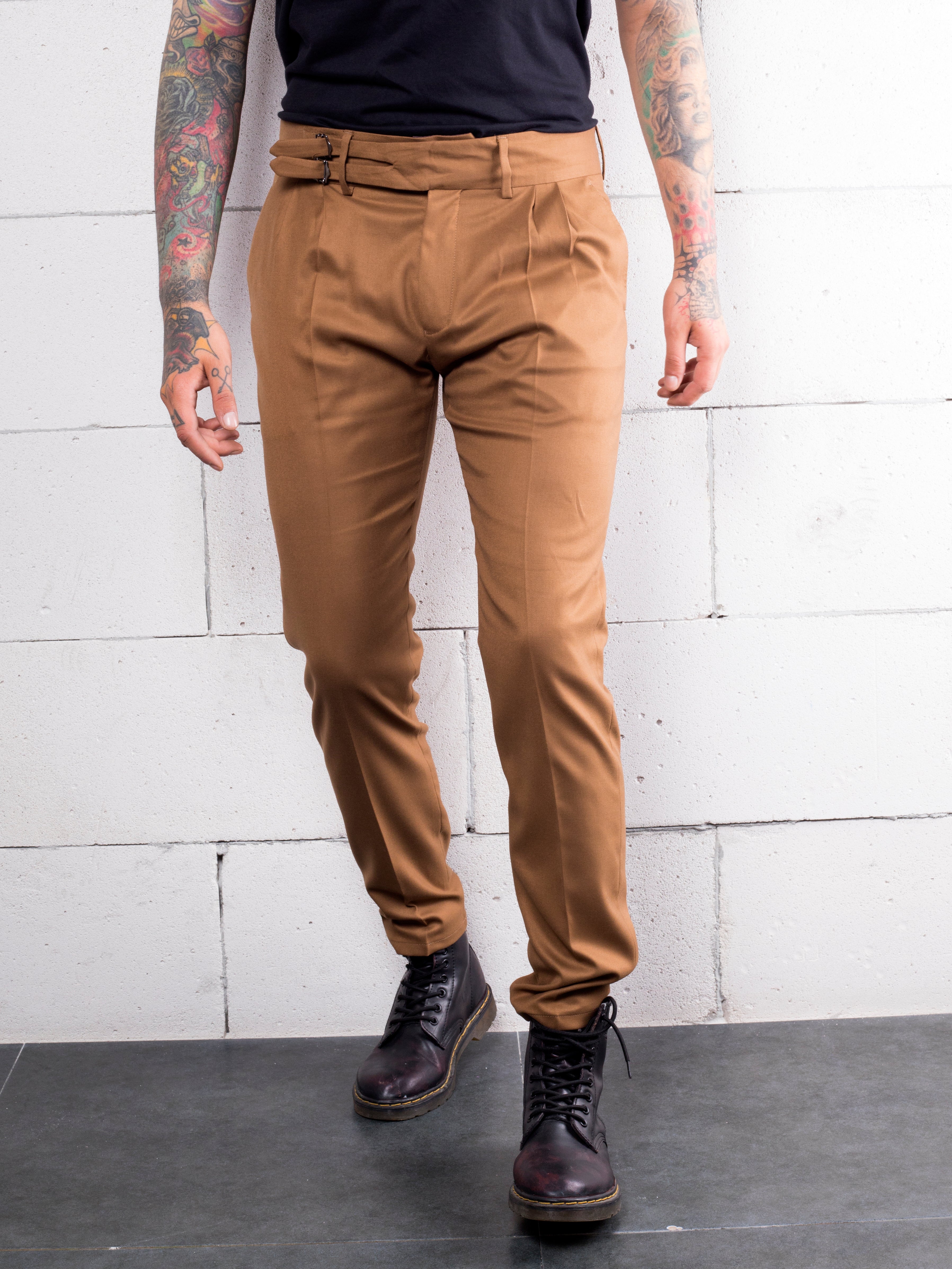 A man with Italian fabric tattoos wearing CROISSANT cotton-stretch tan chinos from Los Angeles.