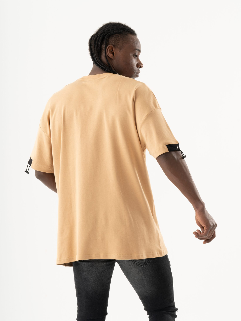 The back of a man wearing a MOSCO T-SHIRT.