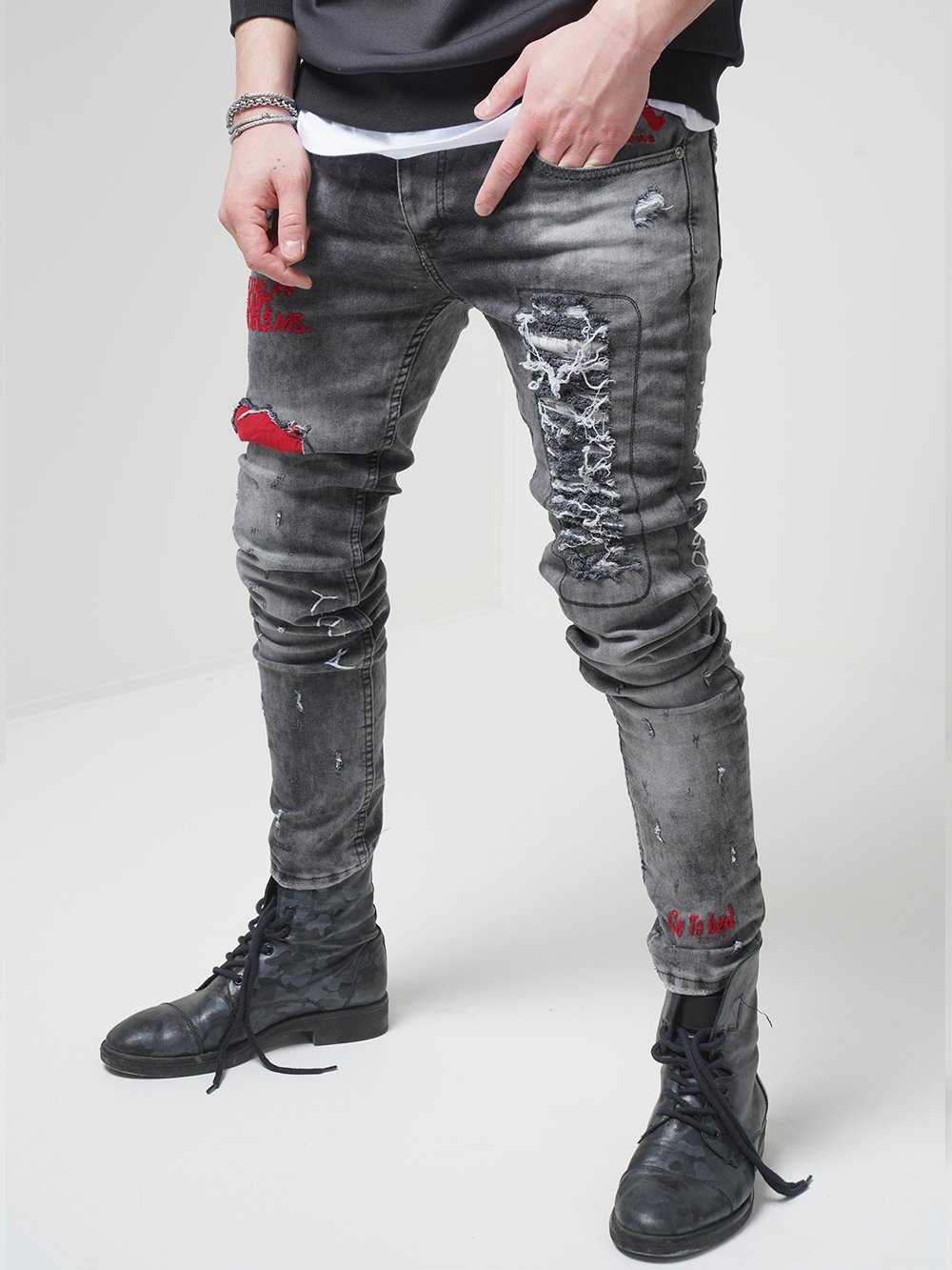 Side shot of a man wearing skinny streetwear jeans called THE OUTLAW Jeans by SERNES